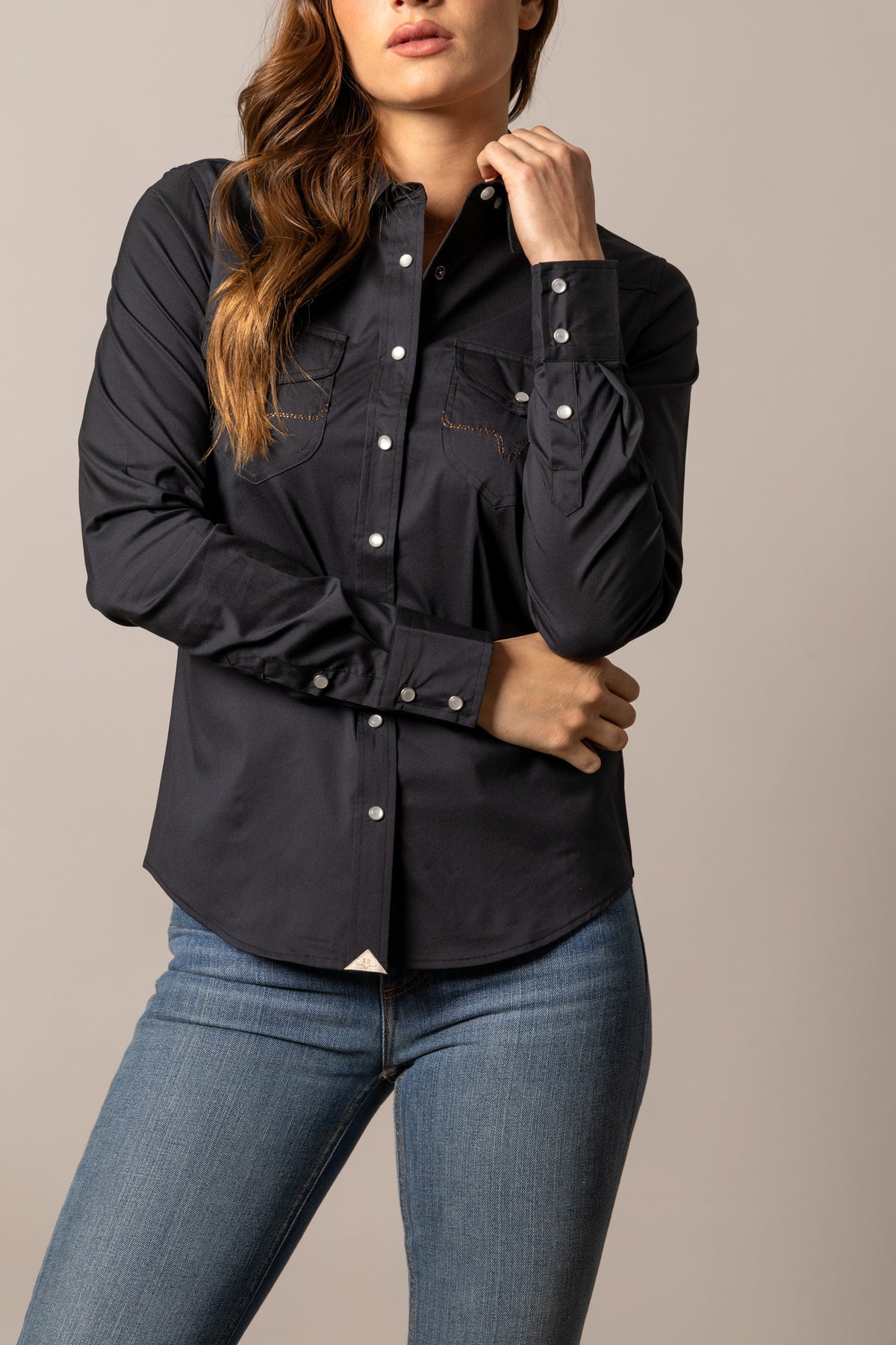Kimes Ranch Skeeter Black long sleeve western top with snap buttons and contrast stitching on the chest pockets