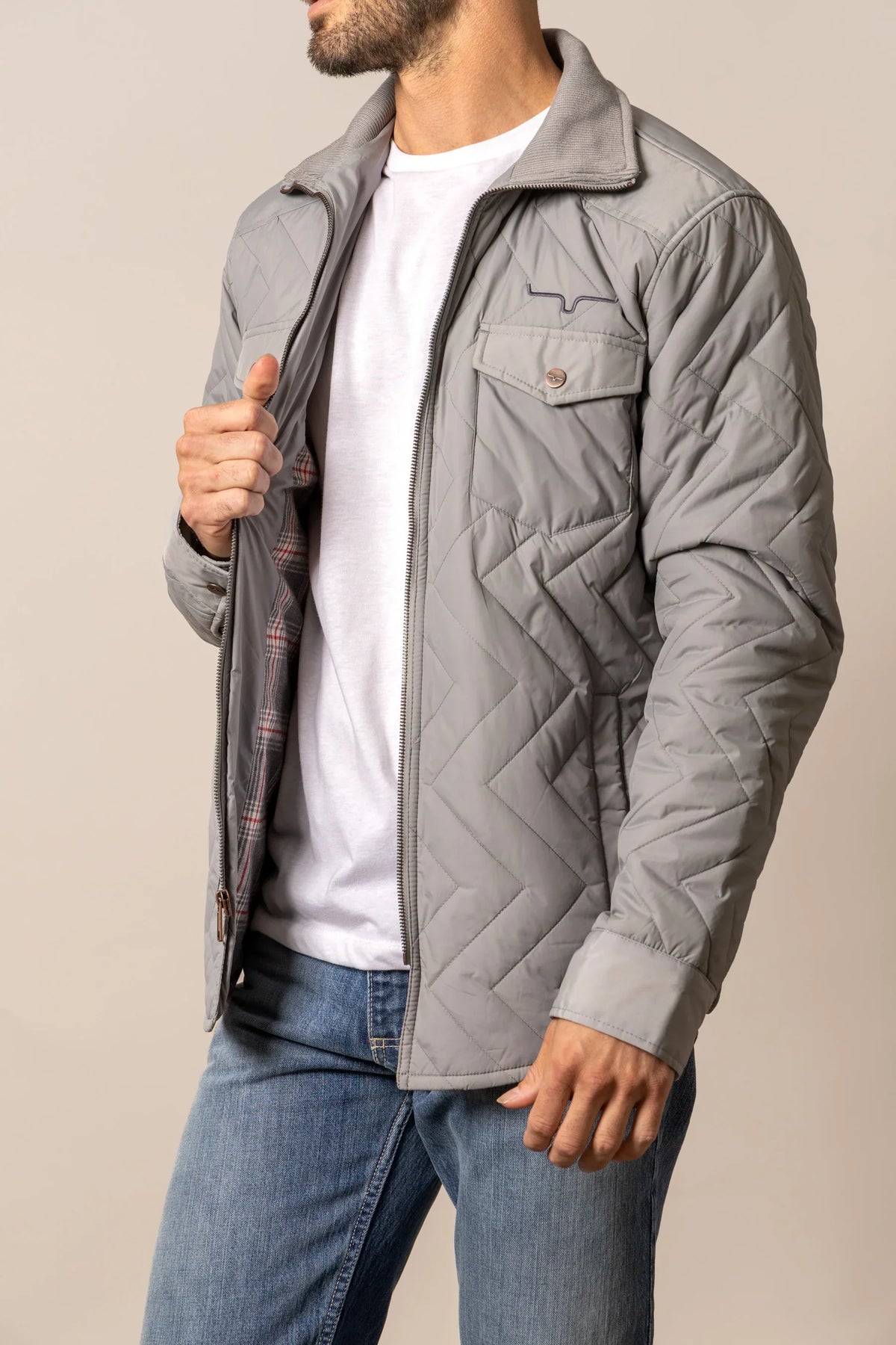 Kimes Ranch Skink Jacket in Grey, side view, with chevron quilting and a plaid lining