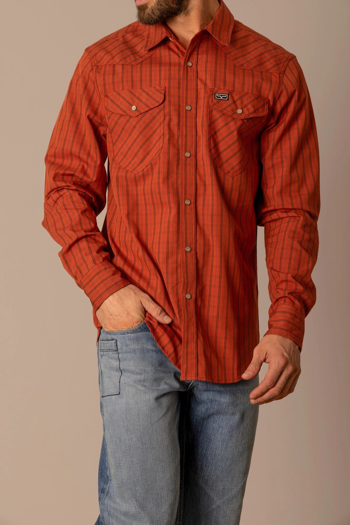Kimes Ranch Smalls dress shirt in Brick Red with long sleeves, two chest pockets, and a Kimes Ranch logo on the left pocket