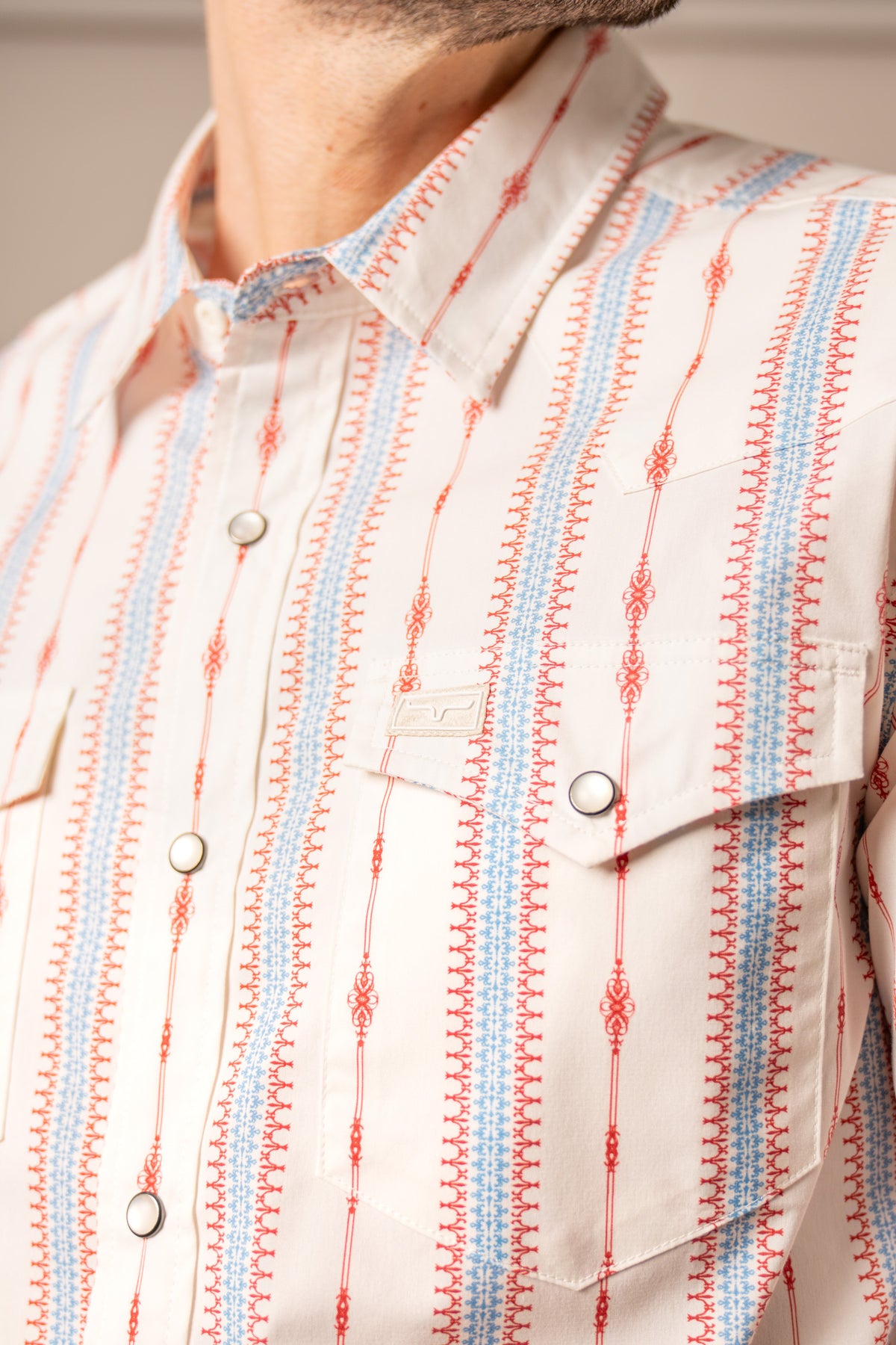 Kimes Ranch Sonny dress shirt in Brick Red, close-up, with vertical red and blue patterned stripes