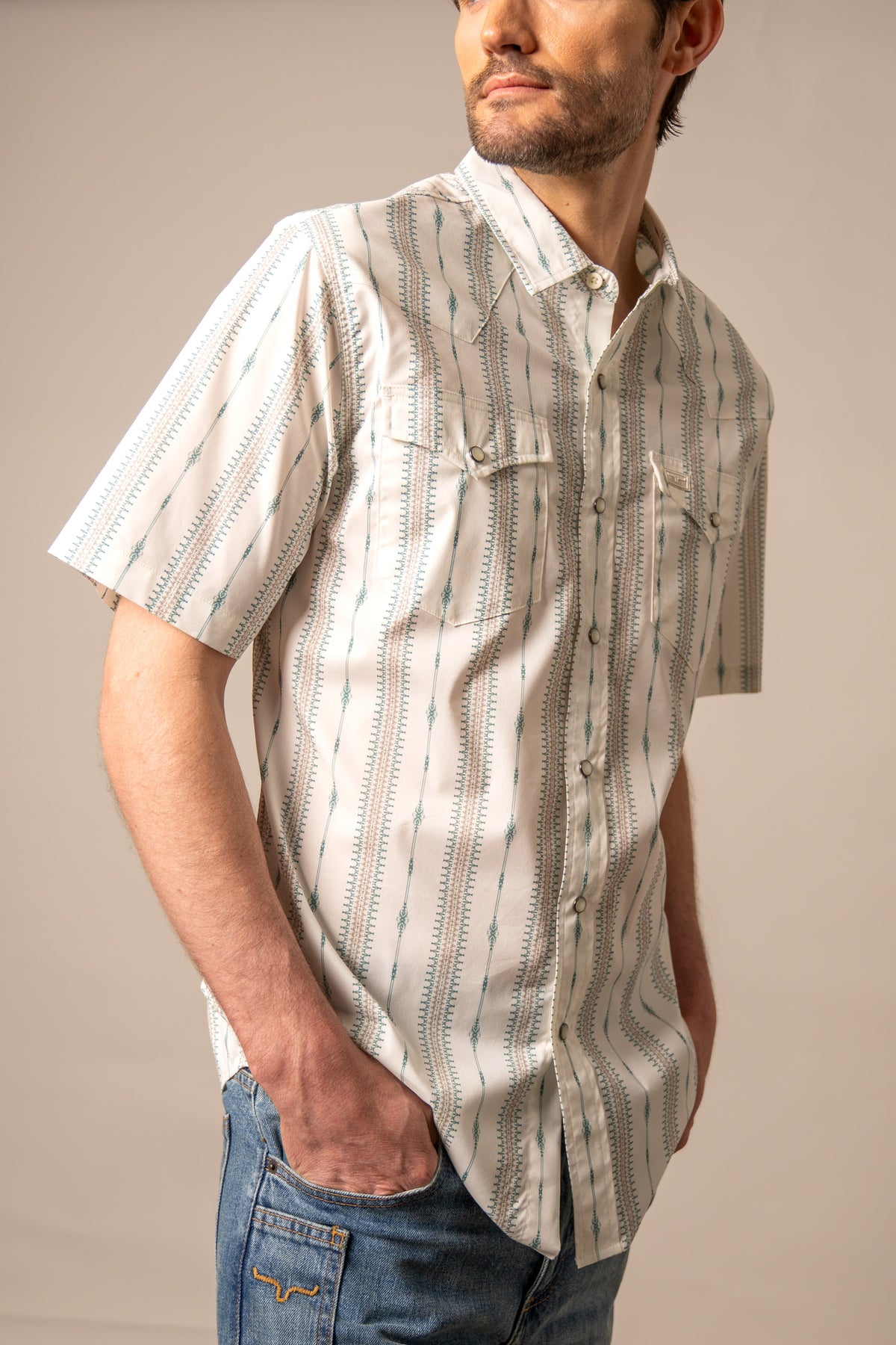 Kimes Ranch Sonny short sleeve dress shirt in Green with a patterned design and two chest pockets