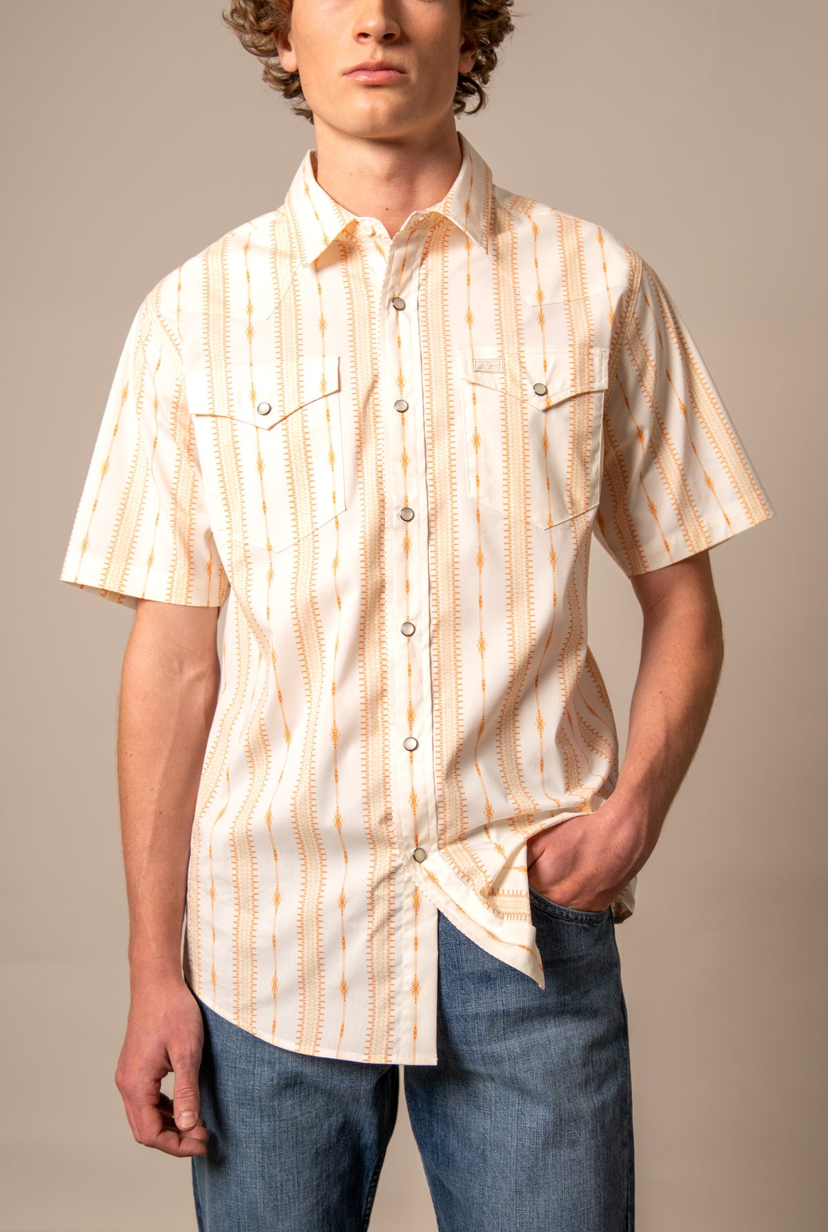 Kimes Ranch Sonny short sleeve dress shirt in Orange with a geometric pattern and two chest pockets