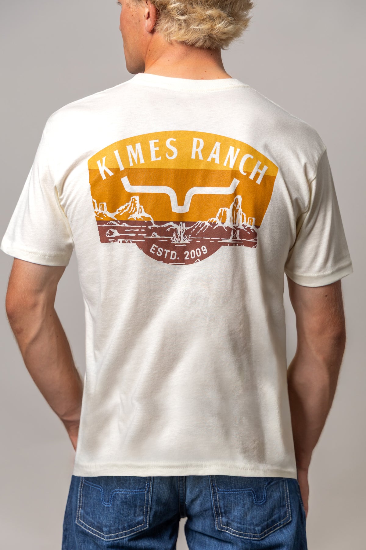 Kimes Ranch Southwestern shirt in Natural, back view, with a back graphic featuring the Kimes Ranch logo