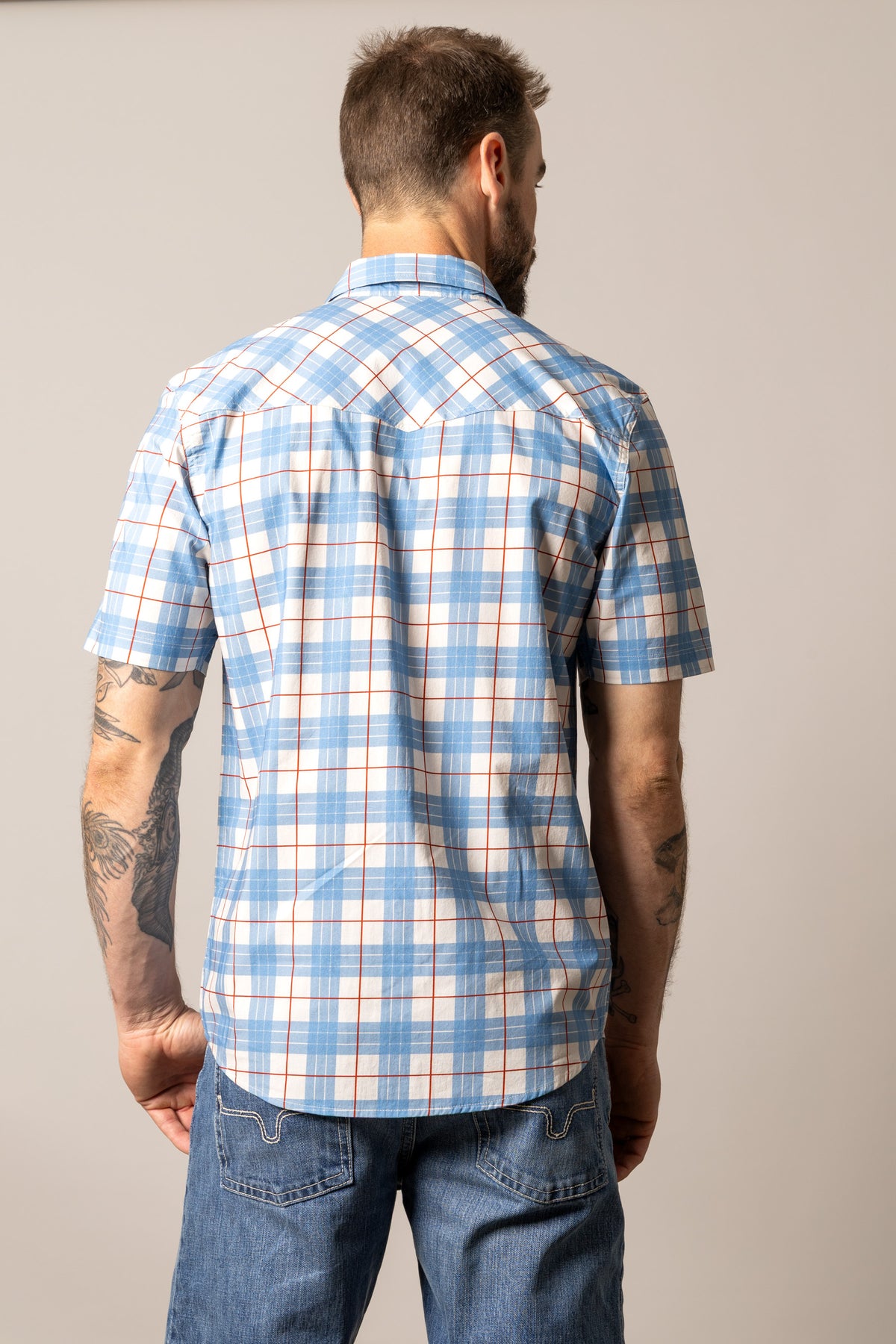 Kimes Ranch Spade dress shirt in Blue, back view, with a white and red plaid pattern and a back yoke