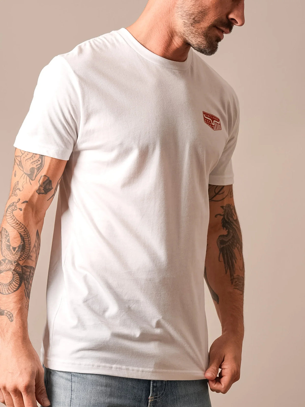 Kimes Ranch Spangled shirt in White, side view, with a red logo on the chest