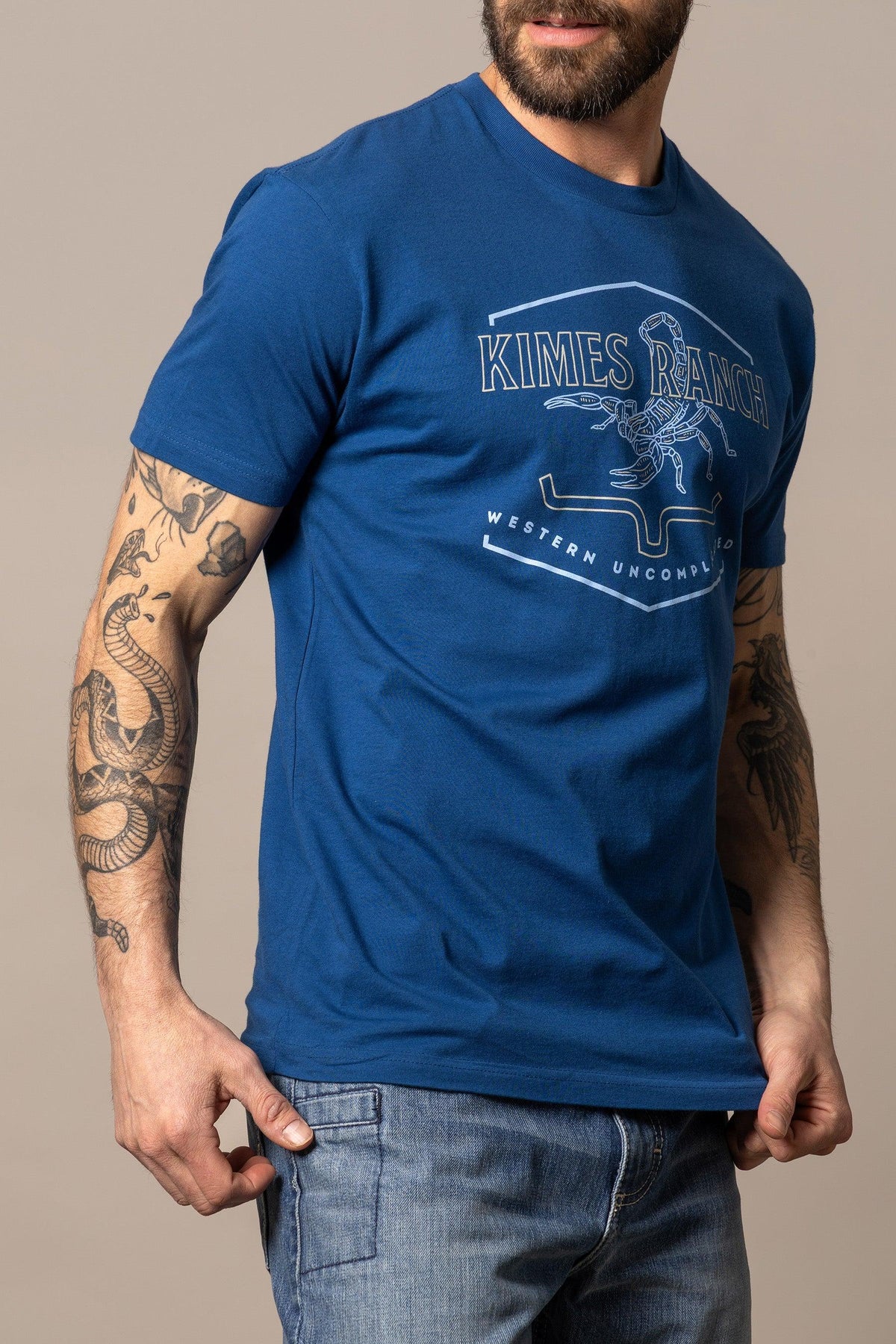 Kimes Ranch Sting shirt in Marine Blue with a scorpion graphic and Western Uncompromised text