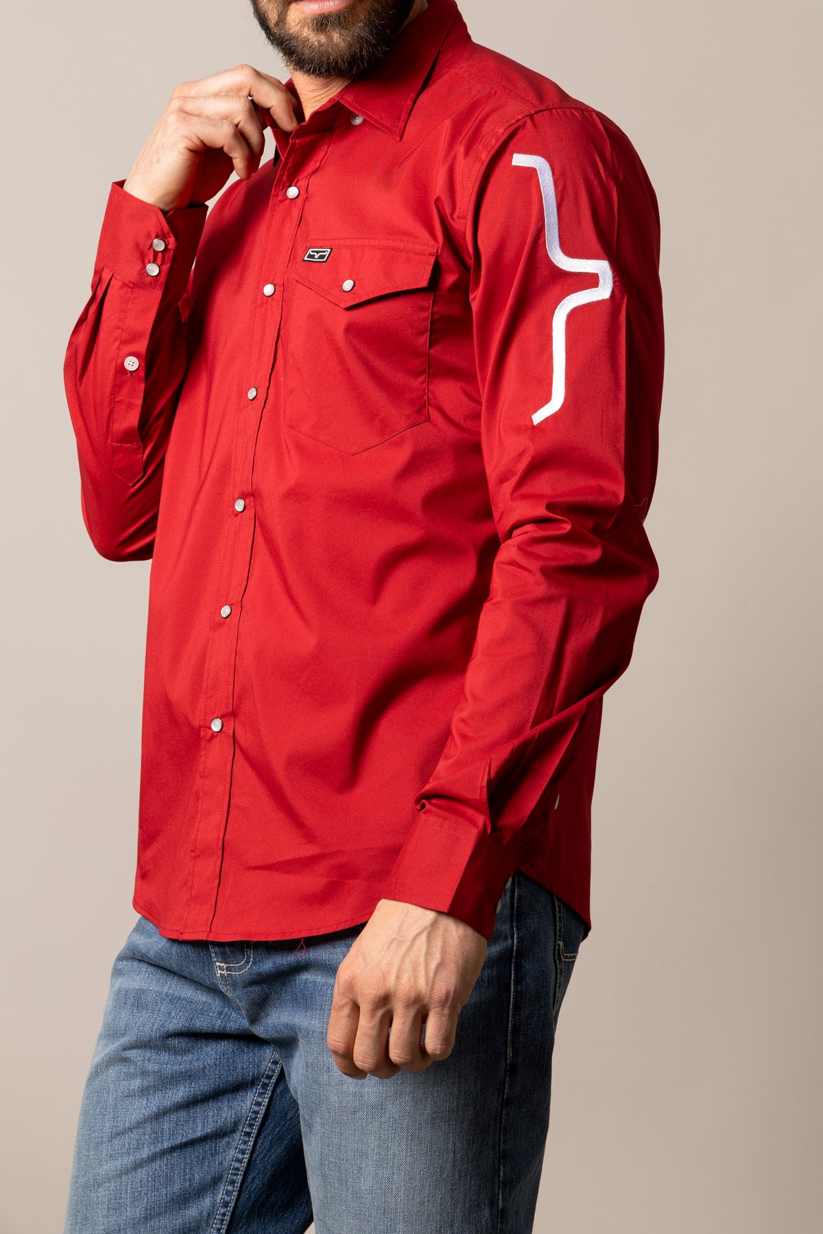 Kimes Ranch Talbott long sleeve dress shirt in Red, side view, with a chest pocket and white graphic on the sleeve