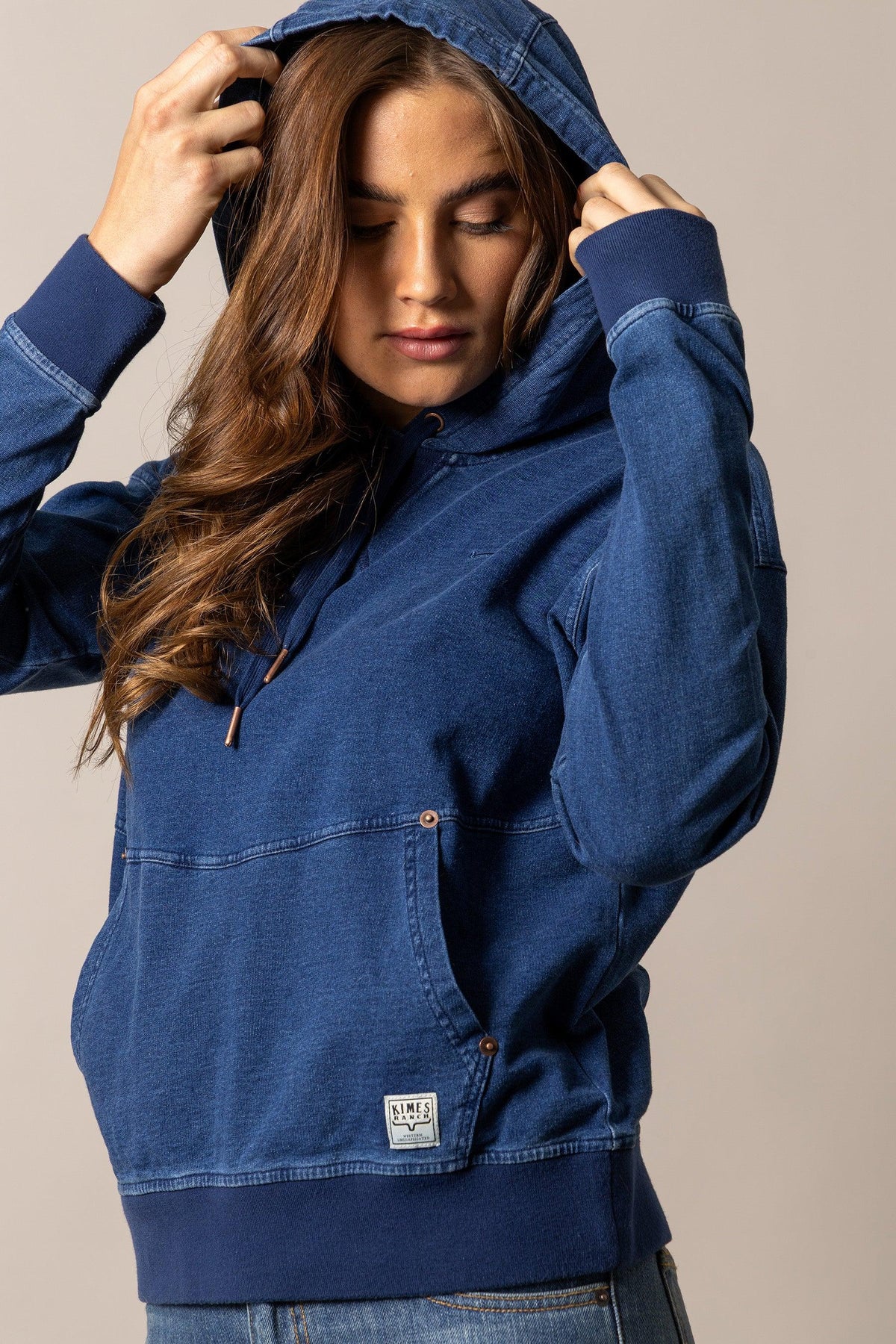 Kimes Ranch Tess Western Hoodie in Indigo Blue with a front kangaroo pocket and logo patch