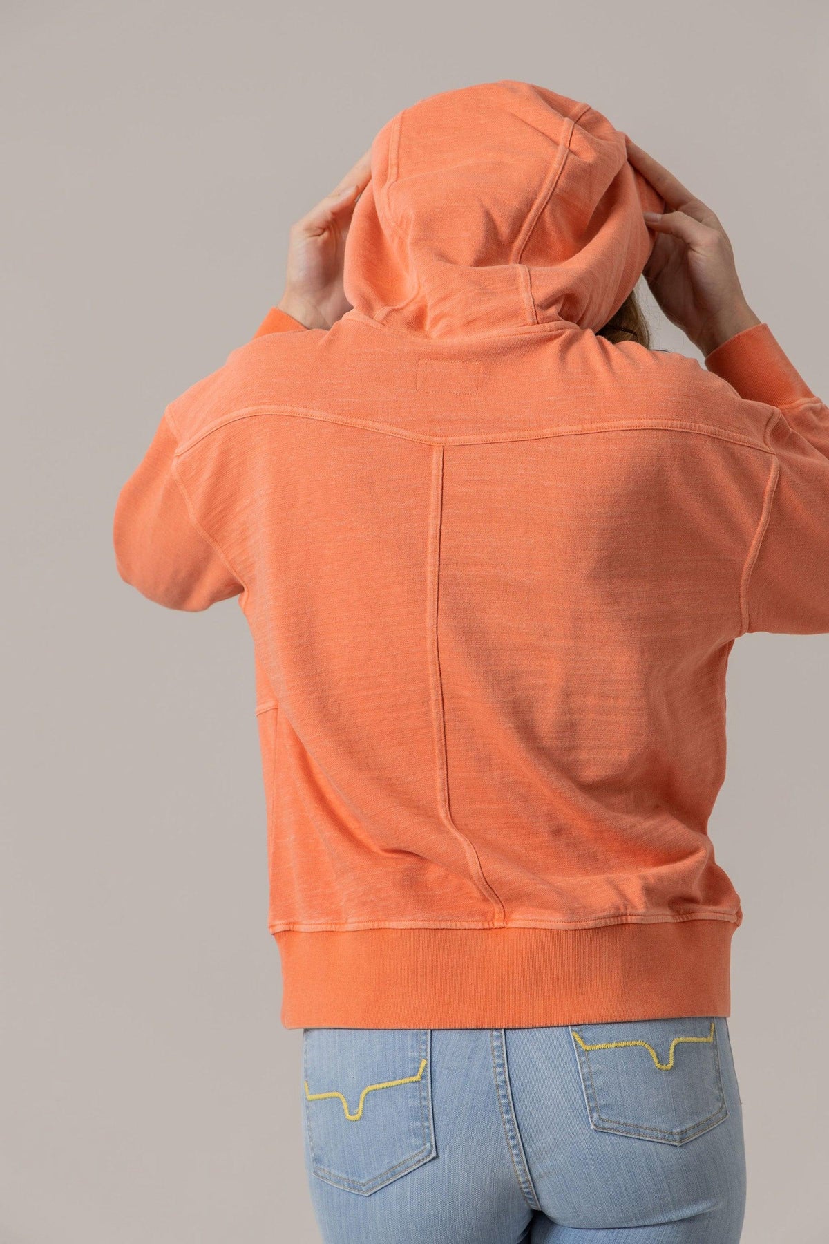 Kimes Ranch Tess Western Hoodie in Orange, back view, with a back yoke and long sleeves