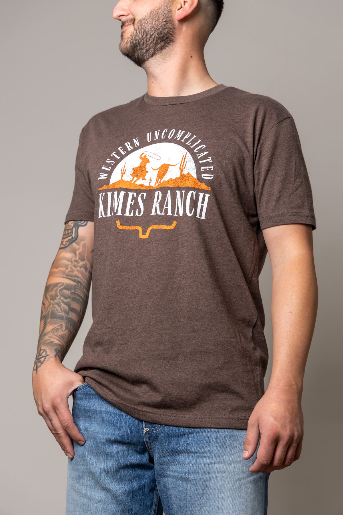 Kimes Ranch The Chase shirt in Espresso with a Western Uncomplicated graphic and Kimes Ranch logo