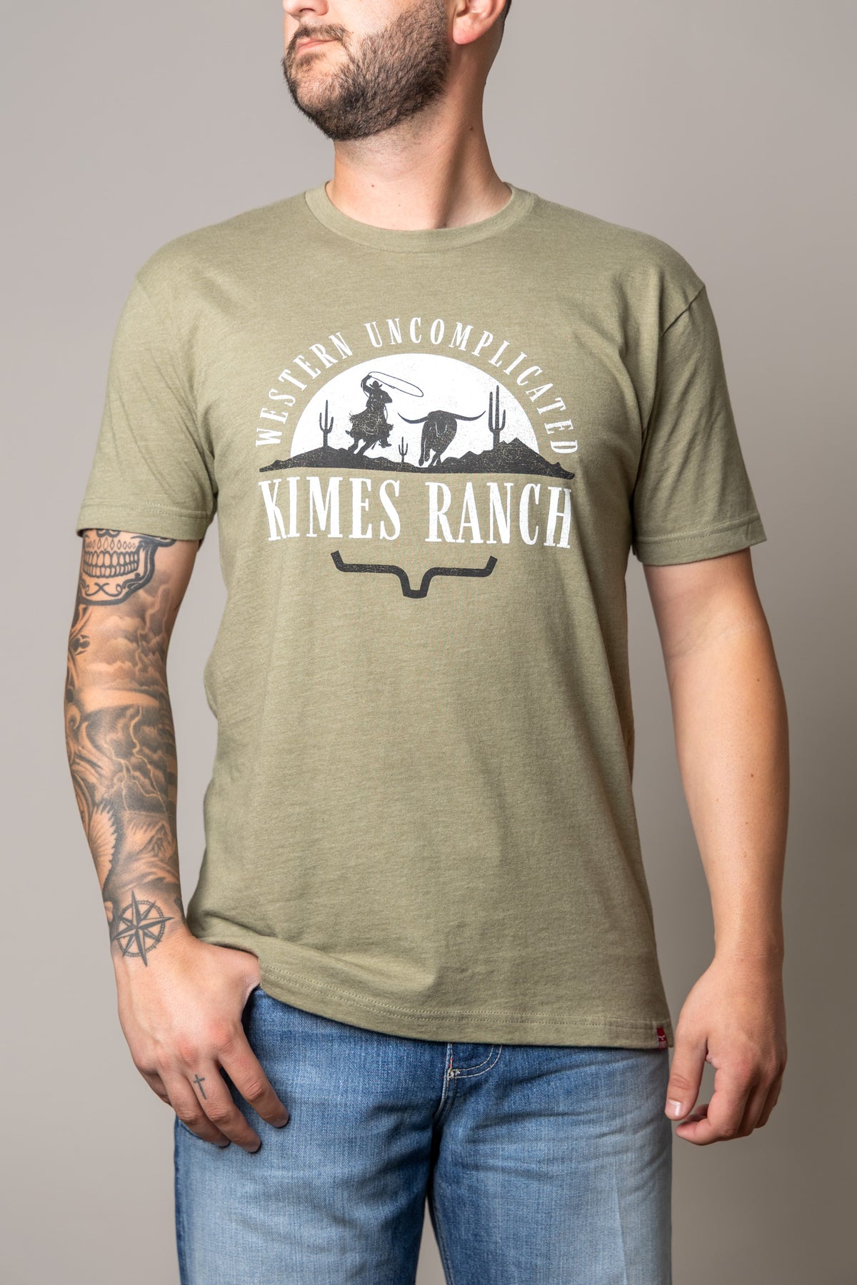 Kimes Ranch The Chase shirt in Light Olive with a Western Uncomplicated graphic featuring a cowboy and longhorn