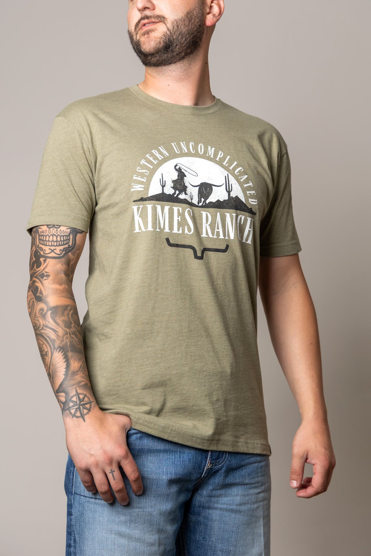 Kimes Ranch The Chase shirt in Light Olive with a Western Uncomplicated graphic featuring a cowboy and longhorn