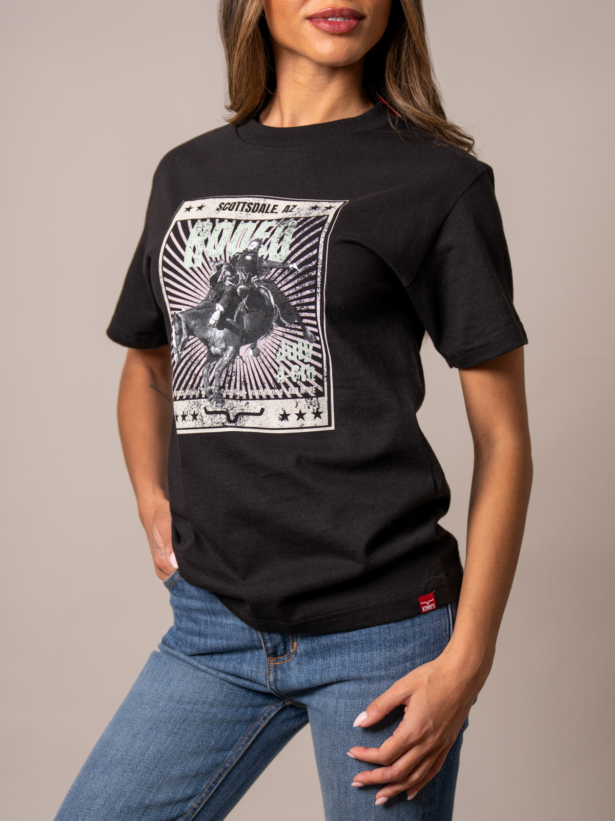 Kimes Ranch Top Bill shirt in Black with a graphic of a cowboy on a bucking horse and the word RODEO