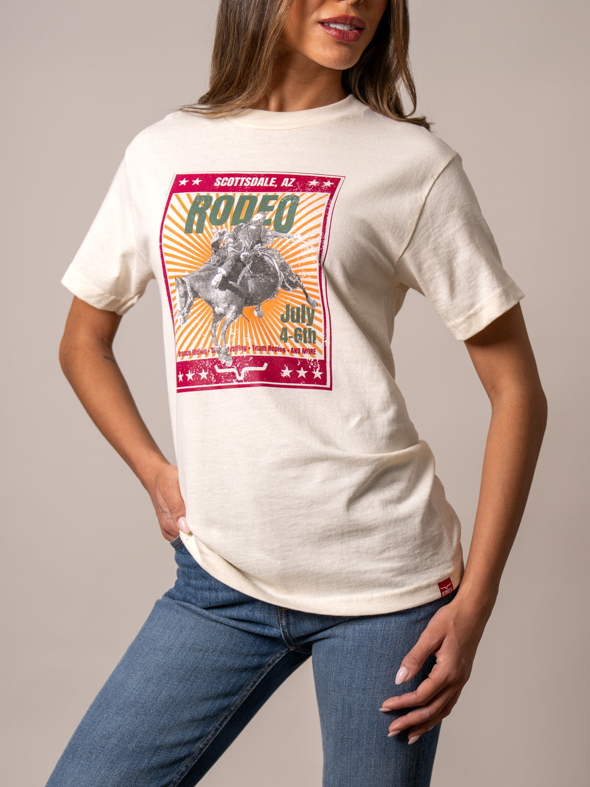 Kimes Ranch Top Bill shirt in Cream with a Scottsdale rodeo graphic featuring a bucking horse and stars