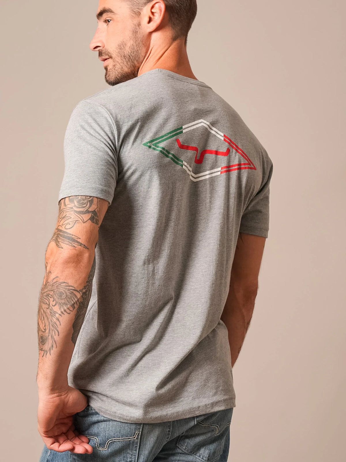 Kimes Ranch Tredwell shirt in Dark Grey Heather, back view, with a back graphic of the Kimes Ranch logo in green, white