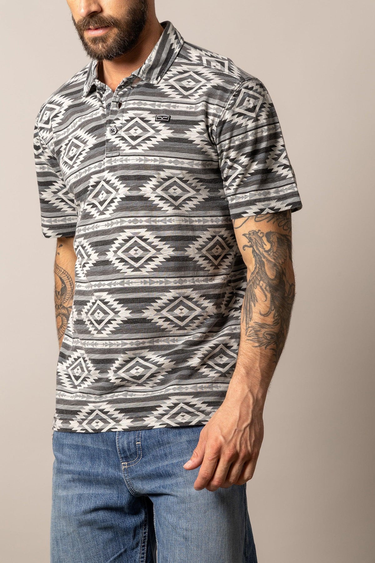Kimes Ranch Tulum Polo in Grey with a geometric diamond pattern and short sleeves