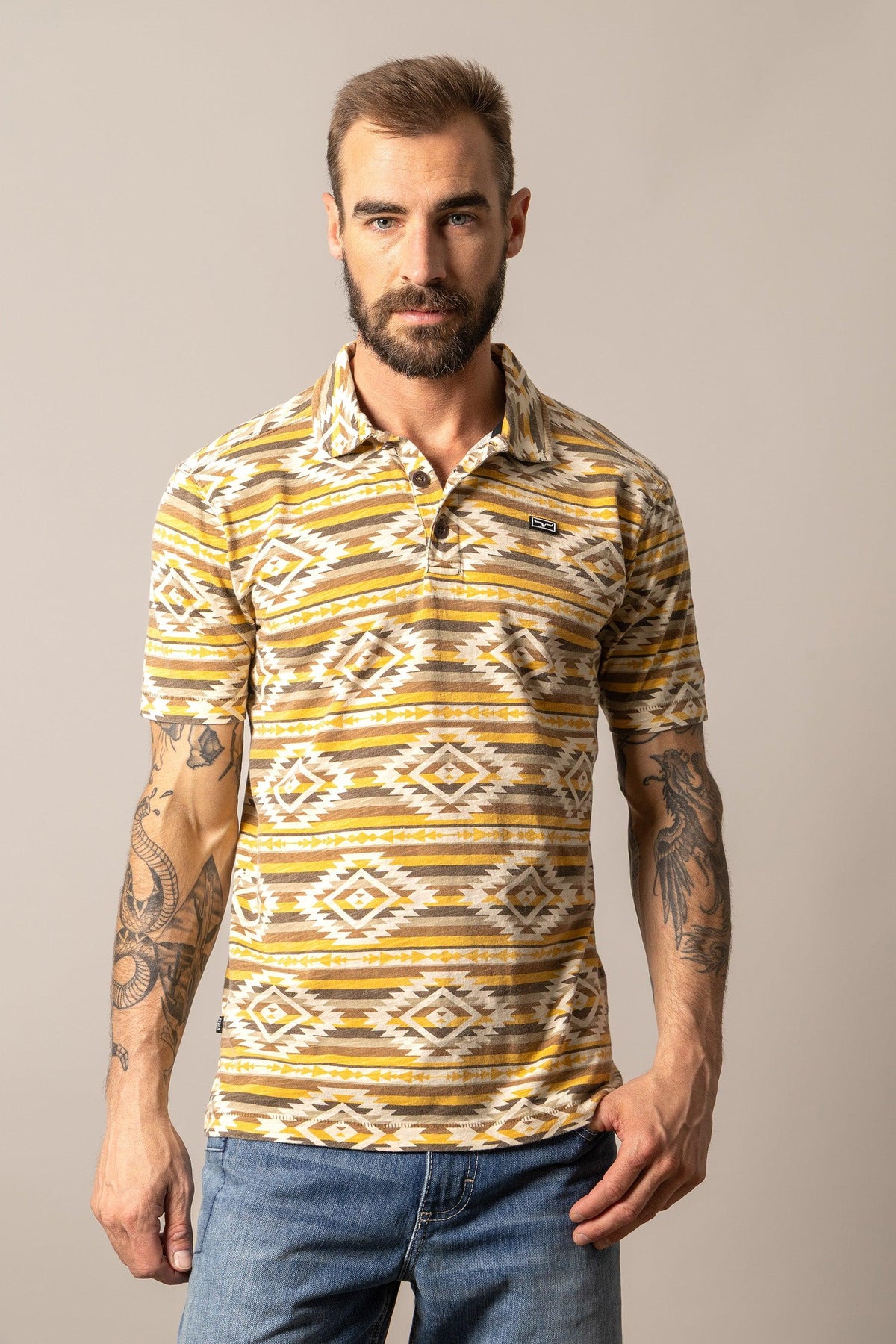 Kimes Ranch Tulum Polo in Gold with a geometric pattern and short sleeves