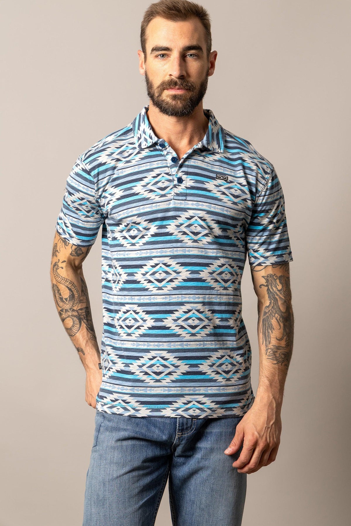 Kimes Ranch Tulum Polo in Navy with a geometric diamond pattern in blue and white and a chest logo