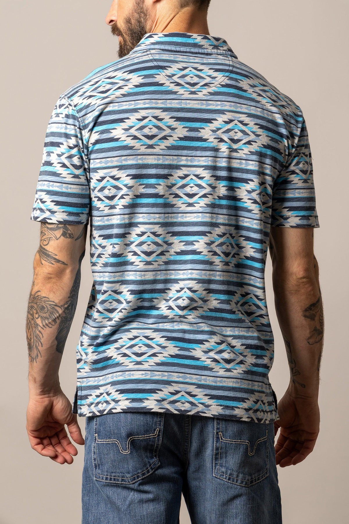 Kimes Ranch Tulum Polo in Navy, back view, with a geometric diamond pattern in blue and white