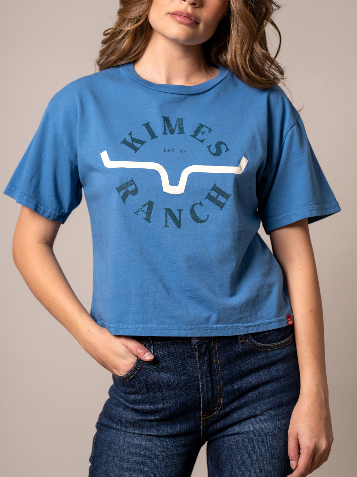 Kimes Ranch Uncomplicated shirt in Carbon Blue with a front graphic featuring the Kimes Ranch logo and text