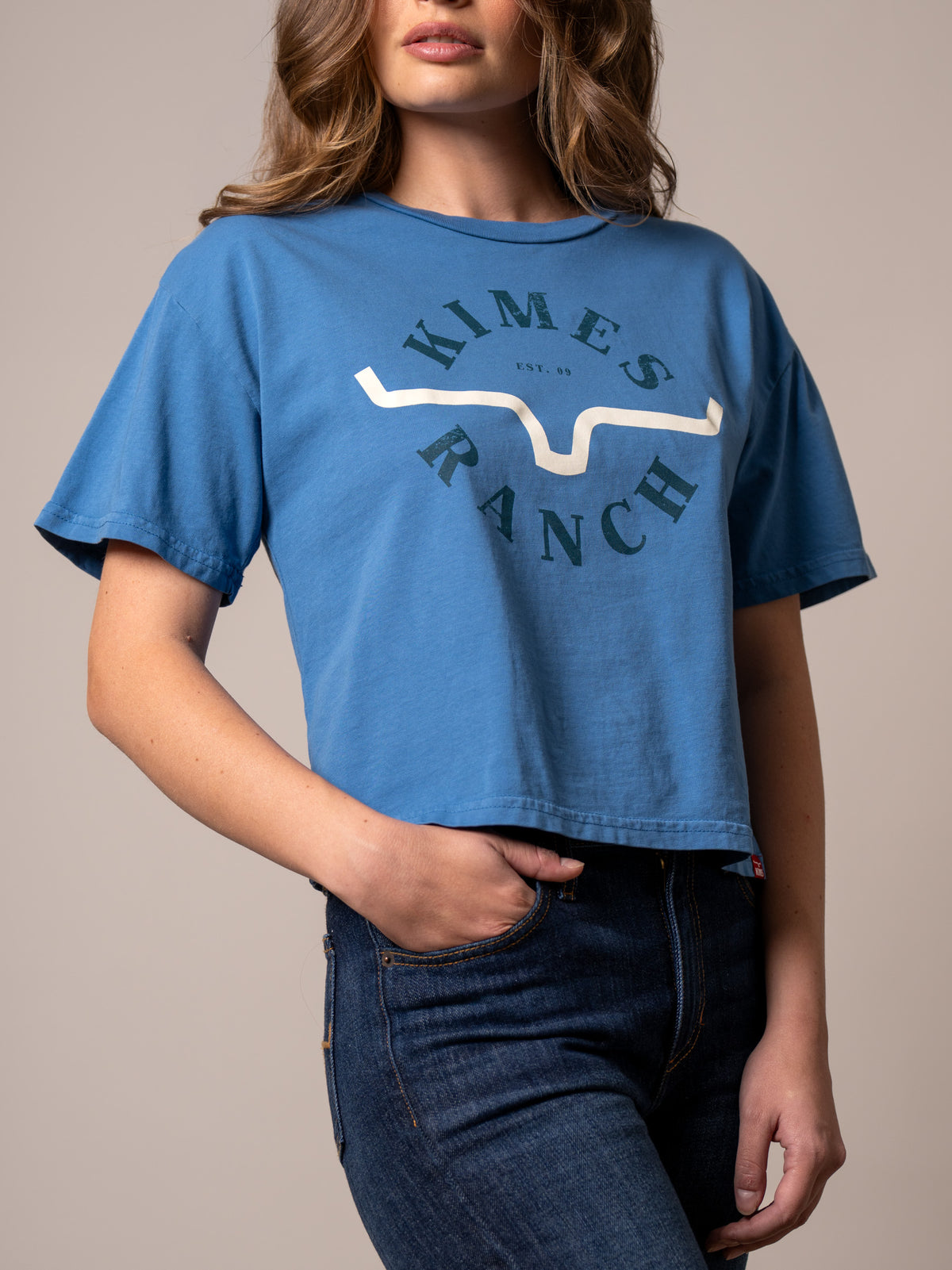 Kimes Ranch Uncomplicated shirt in Carbon Blue with a front graphic featuring the Kimes Ranch logo and text
