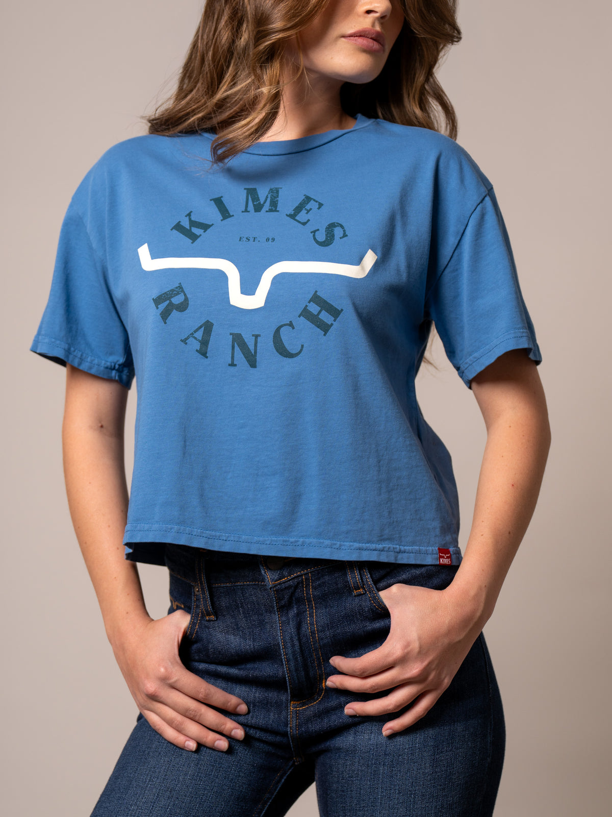 Kimes Ranch Uncomplicated shirt in Carbon Blue with a front graphic featuring the Kimes Ranch logo and text