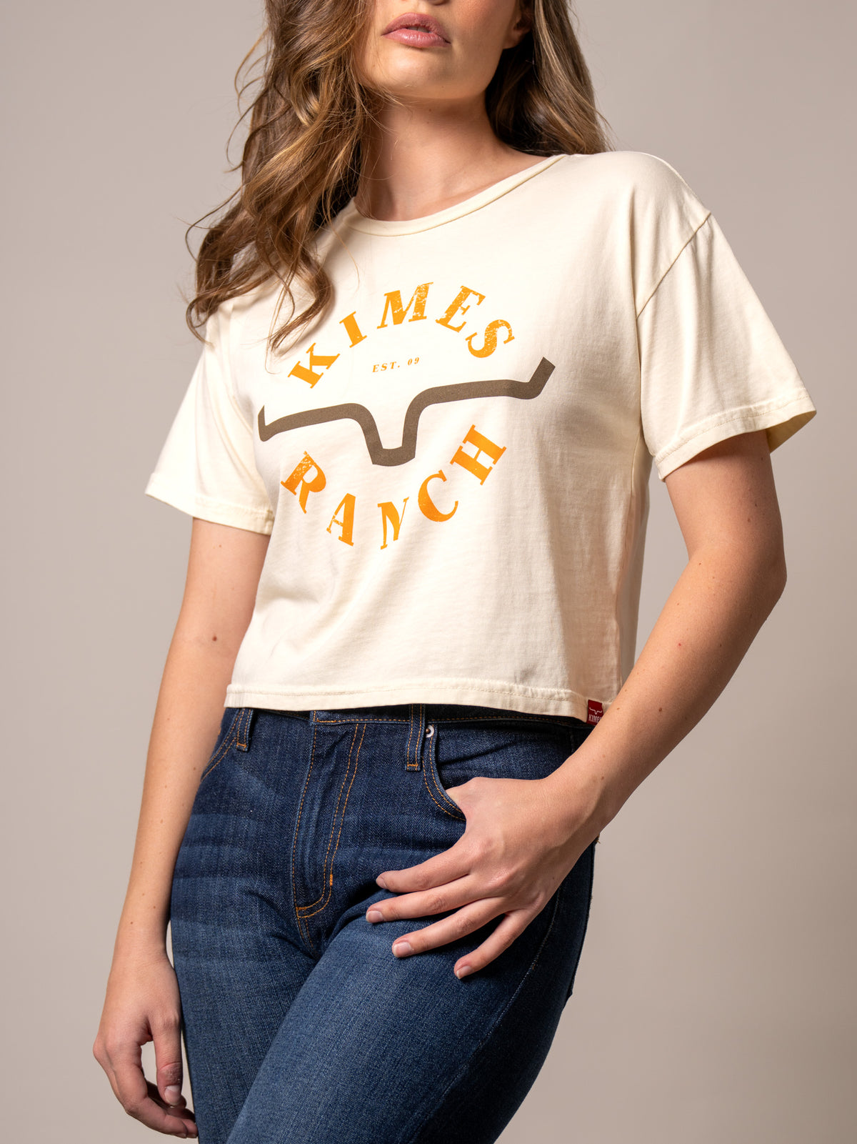 Kimes Ranch Uncomplicated shirt in Ivory with a front graphic featuring the Kimes Ranch logo and EST. 09 text