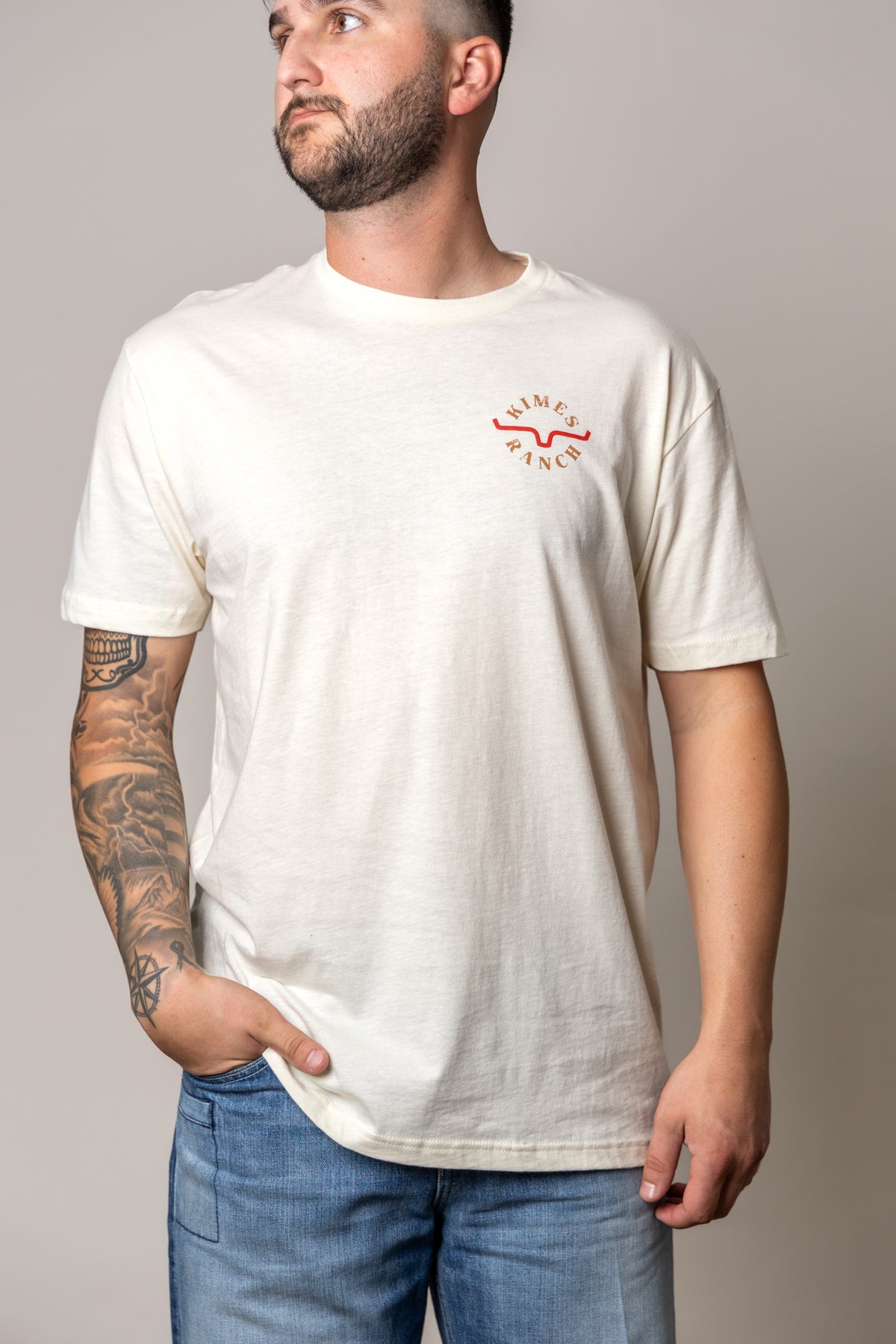 Kimes Ranch Uncomplicated shirt in Natural with a short sleeve crew neck and Kimes Ranch logo on the chest