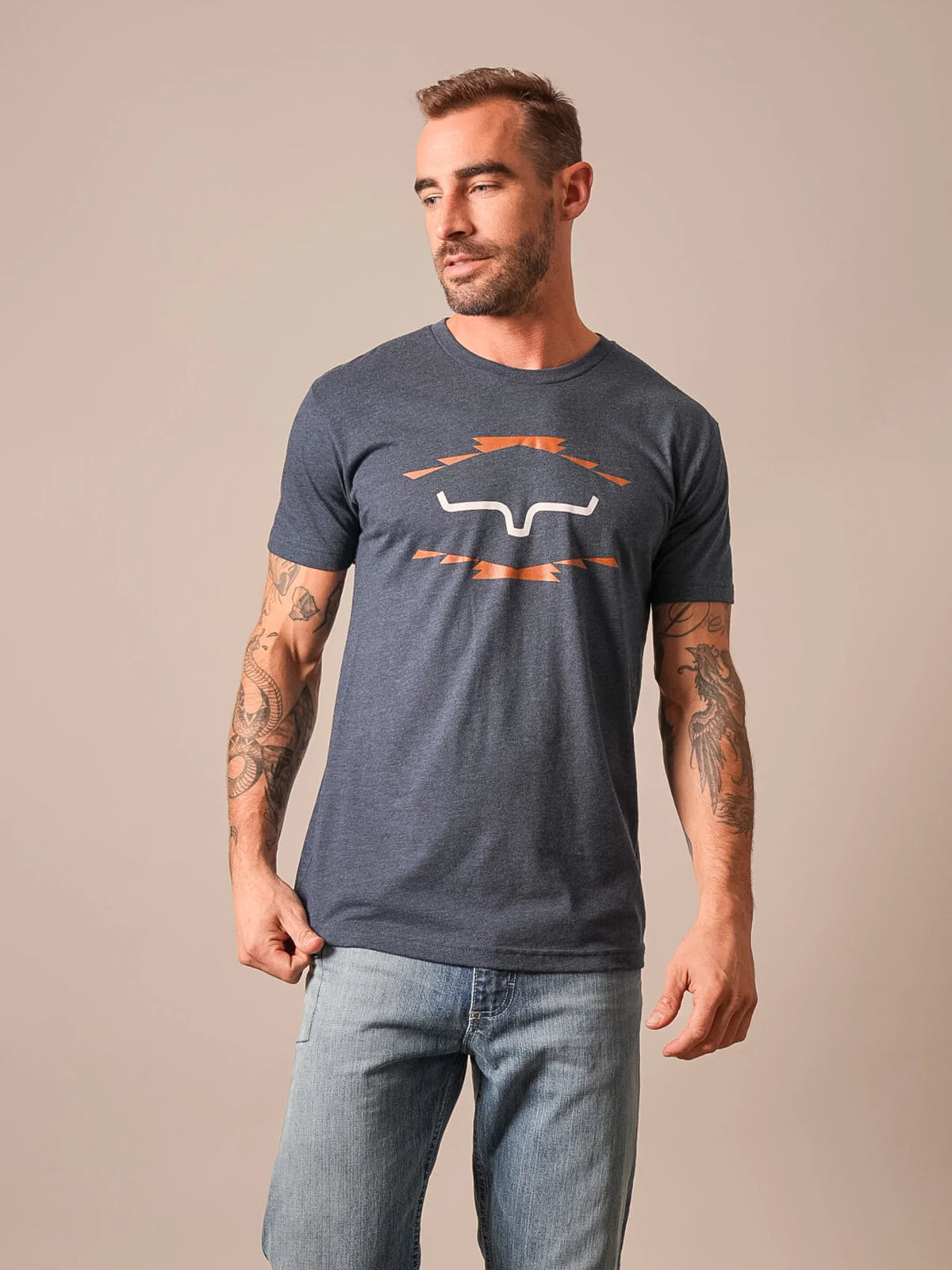 Kimes Ranch Vintage Badge shirt in Midnight Navy with a white and orange graphic print on the front