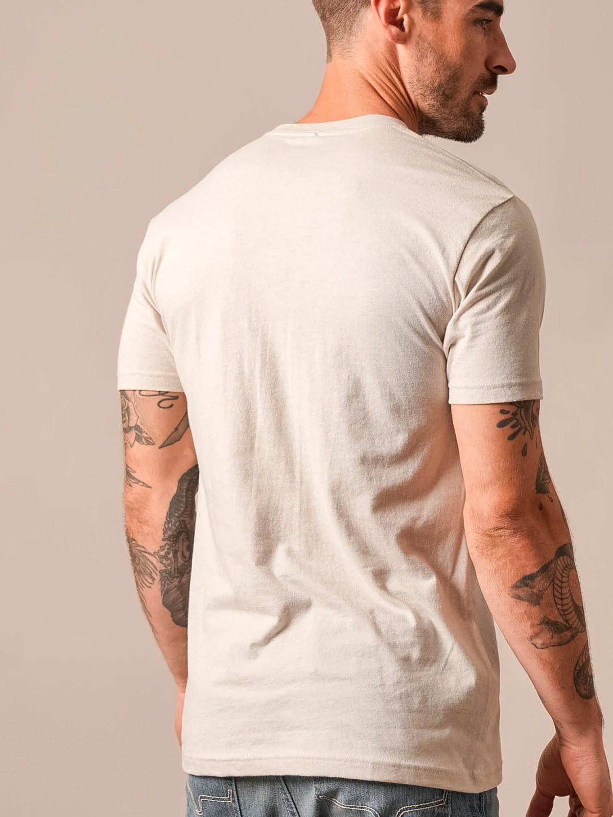 Kimes Ranch Vintage Badge shirt in Sand, back view, with short sleeves and a crew neck