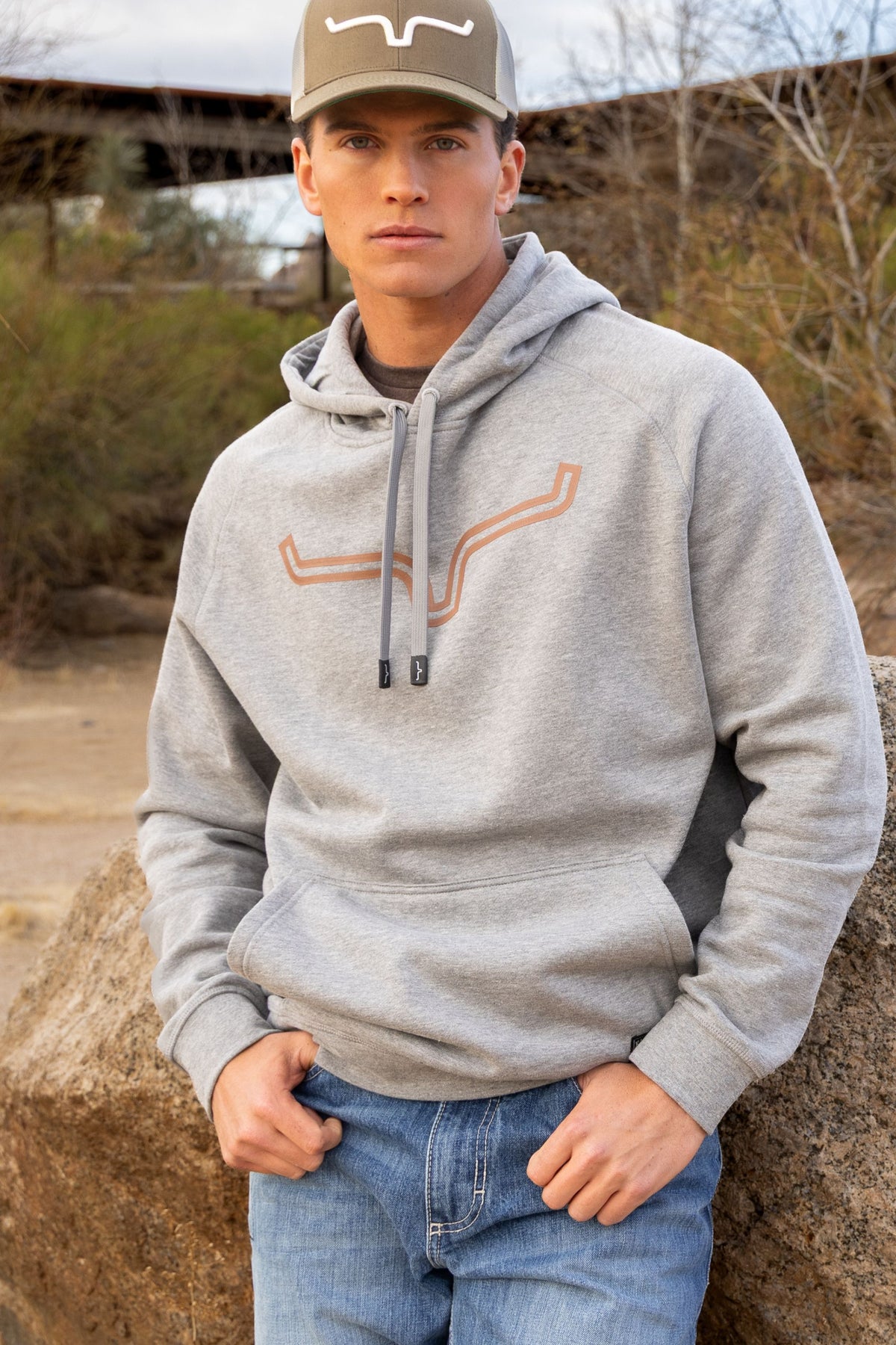 Kimes Ranch Outlier Hoodie in Grey Heather with a longhorn logo graphic on the chest and a front kangaroo pocket