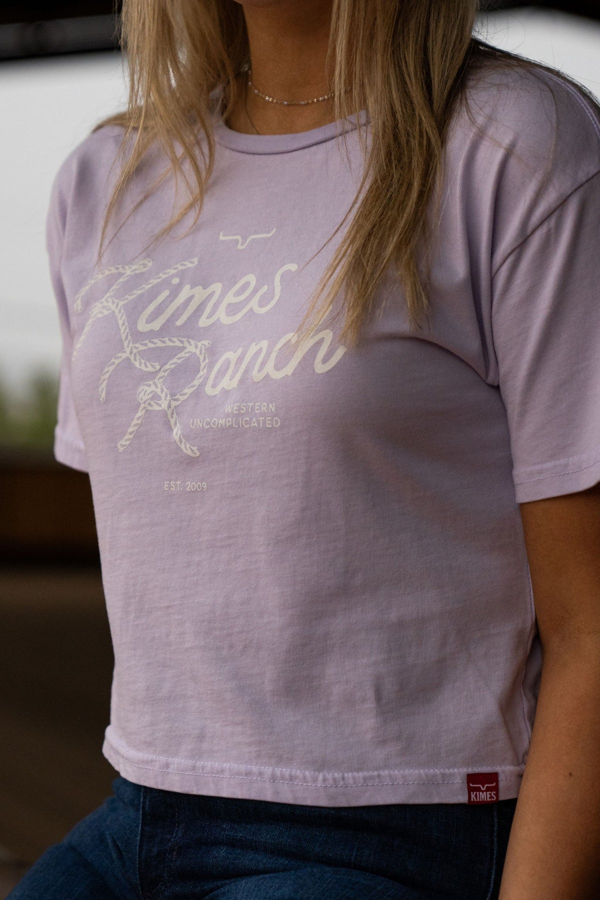 Kimes Ranch Lasso Script shirt in Lavender with a rope graphic and Western Uncomplicated text