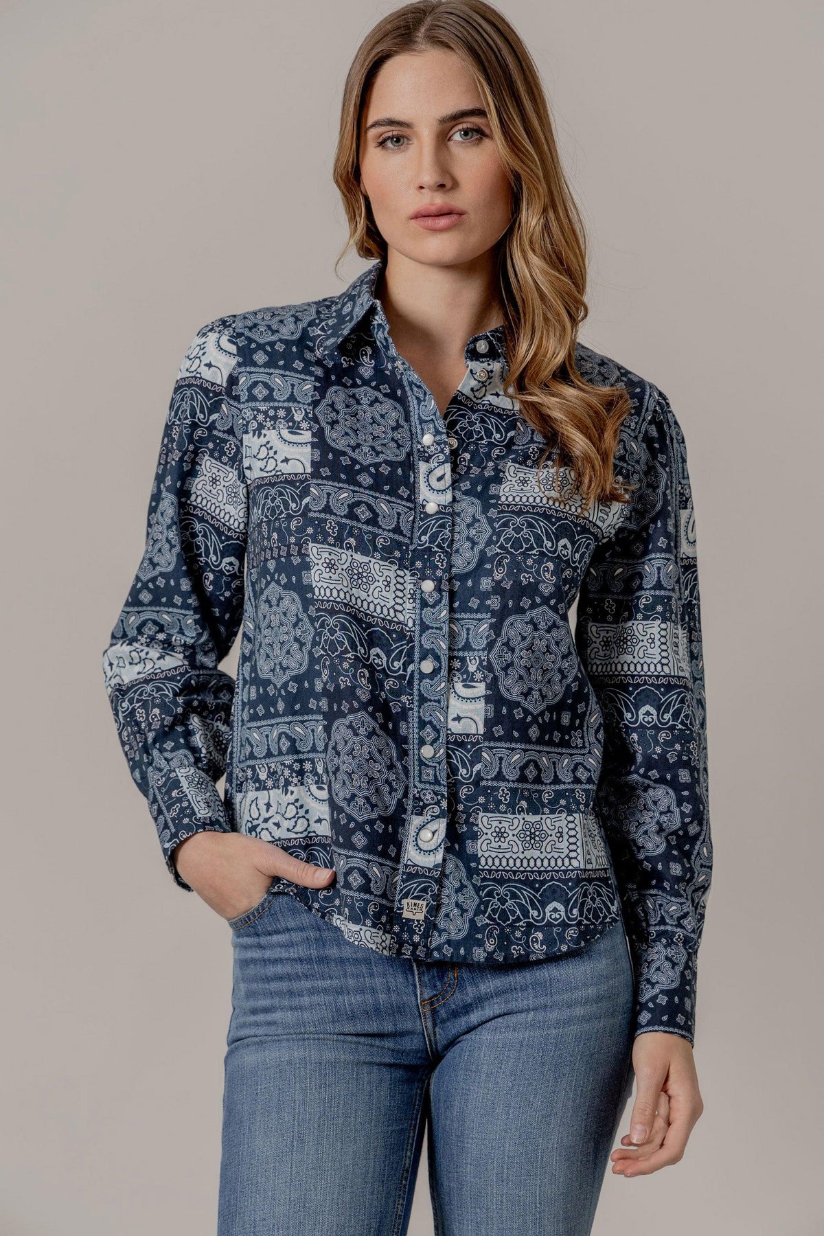 Kimes Ranch Winnie long sleeve button top in Blue with a white bandana print pattern