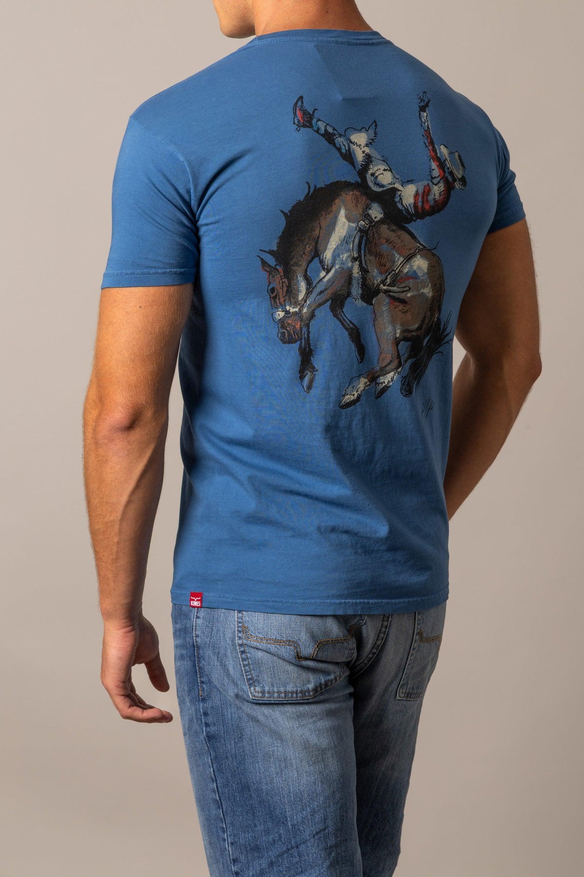 Kimes Ranch Winning Ride RP, back view, shirt in Faded with a back graphic of a cowboy riding a bucking horse