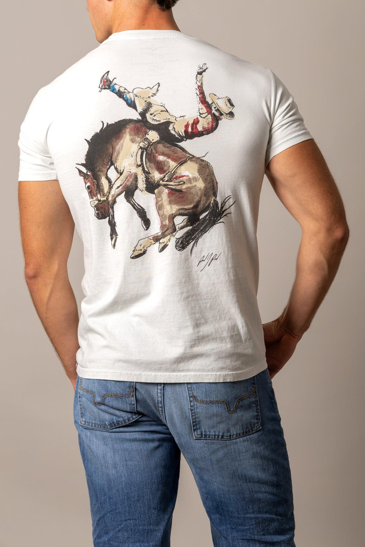 Kimes Ranch Winning Ride RP shirt in Off White, back view, with a back graphic of a cowboy riding a bucking horse