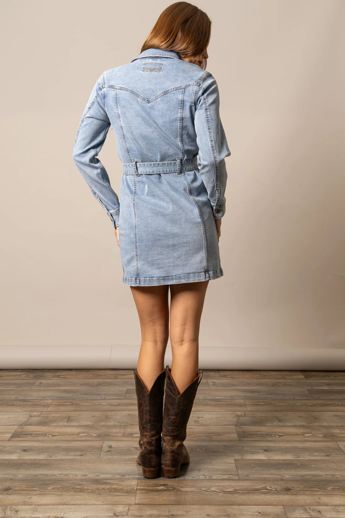 Kimes Ranch Winslow Trucker Dress in Light Wash Indigo, back view, with back yoke stitching and a matching belt