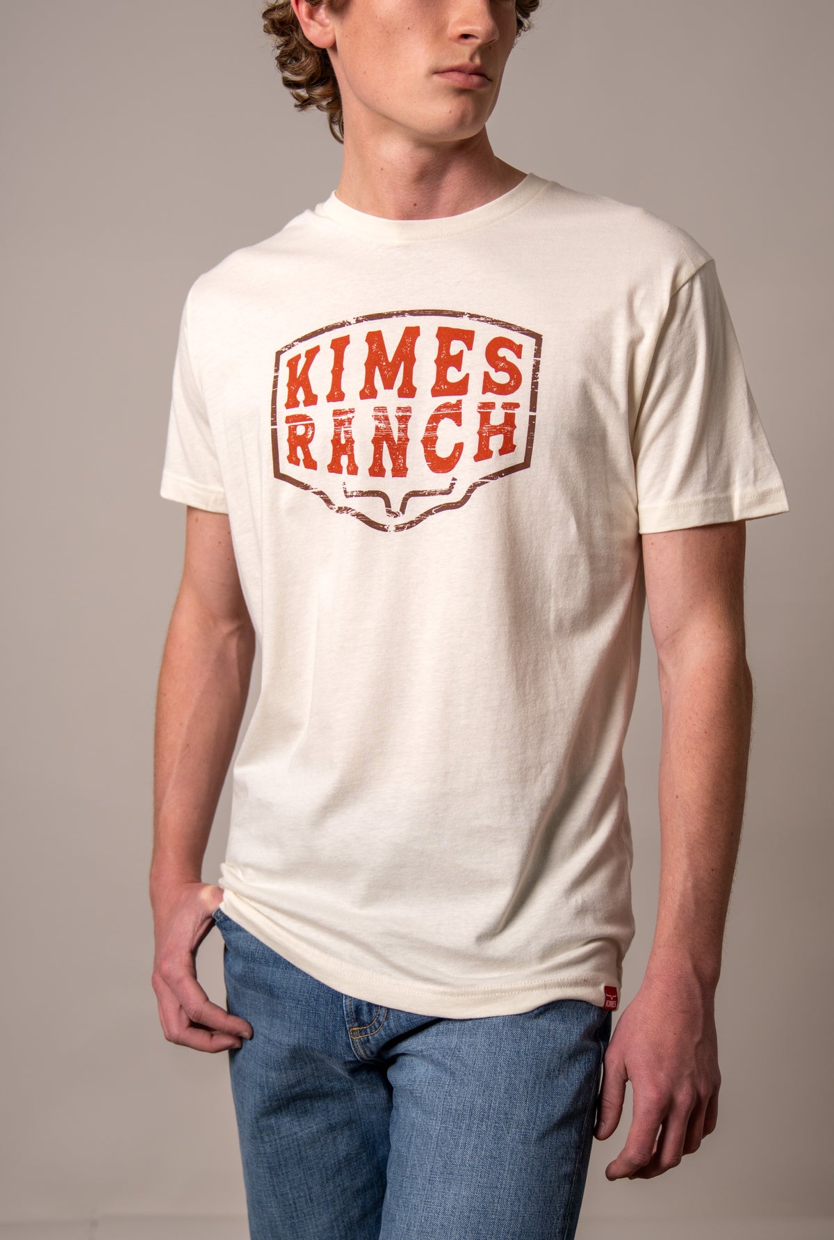 Kimes Ranch Wood Block shirt in Natural with a distressed orange Kimes Ranch logo on the chest
