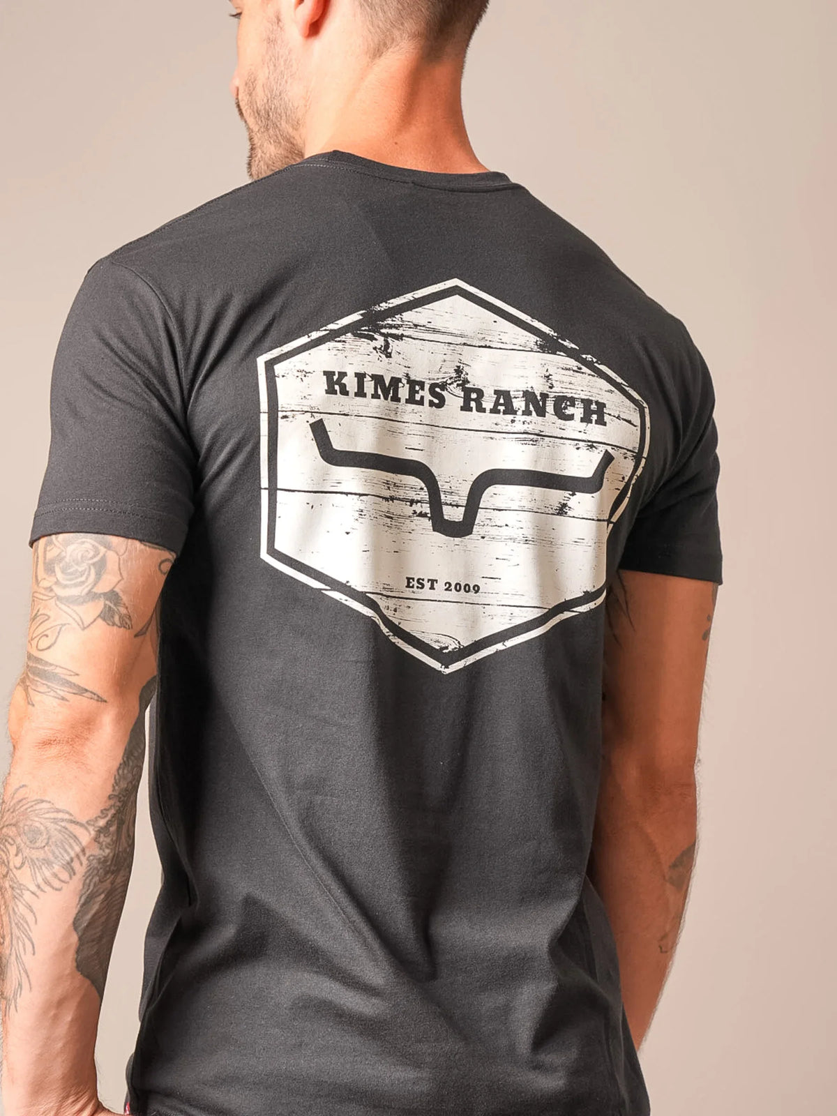 Kimes Ranch Wooden Hex shirt in Black, back view, with a large back graphic featuring the Kimes Ranch logo and EST 2009 text