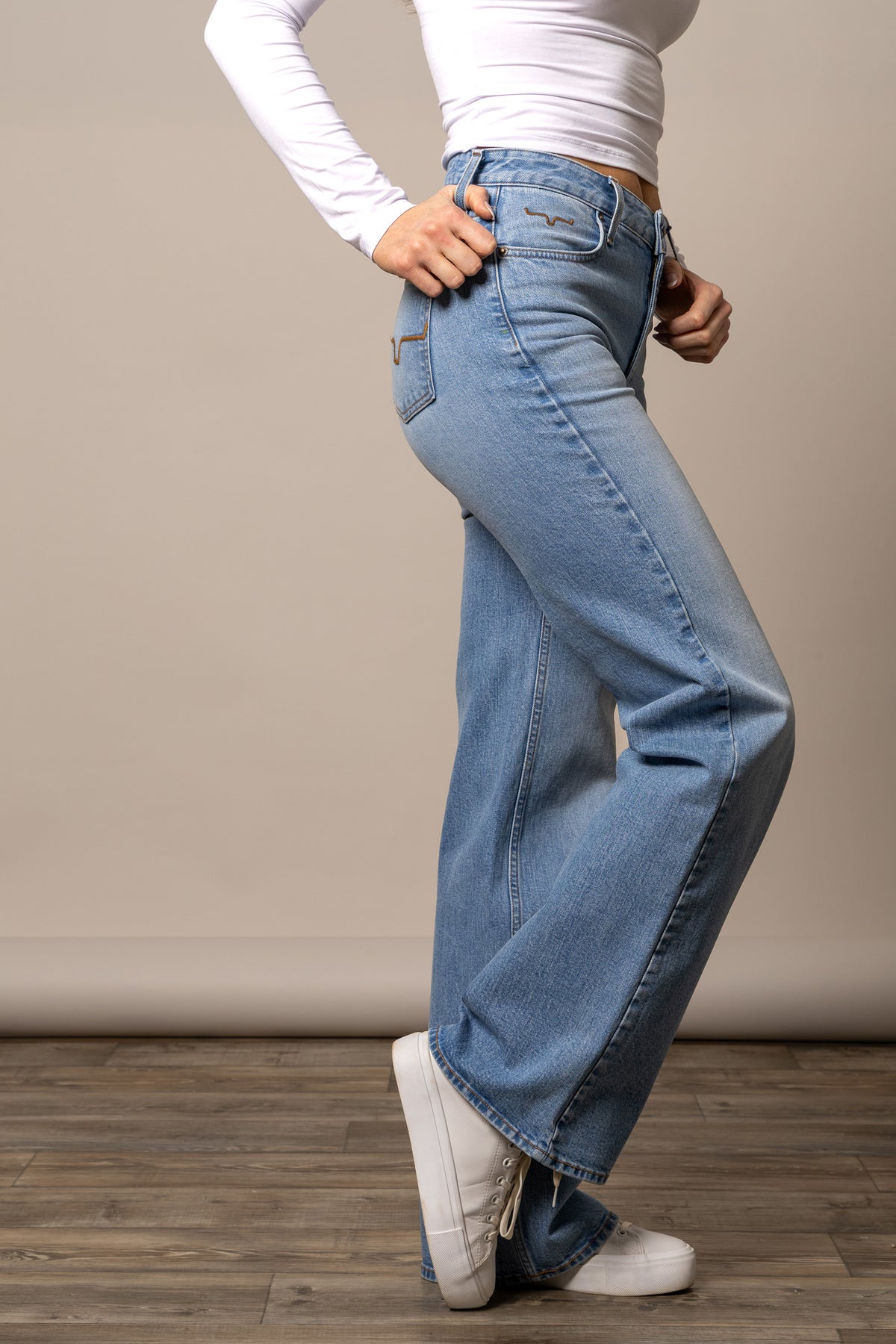 Kimes Ranch Zoey jeans in Light Wash, side view, with a wide leg silhouette and back pockets