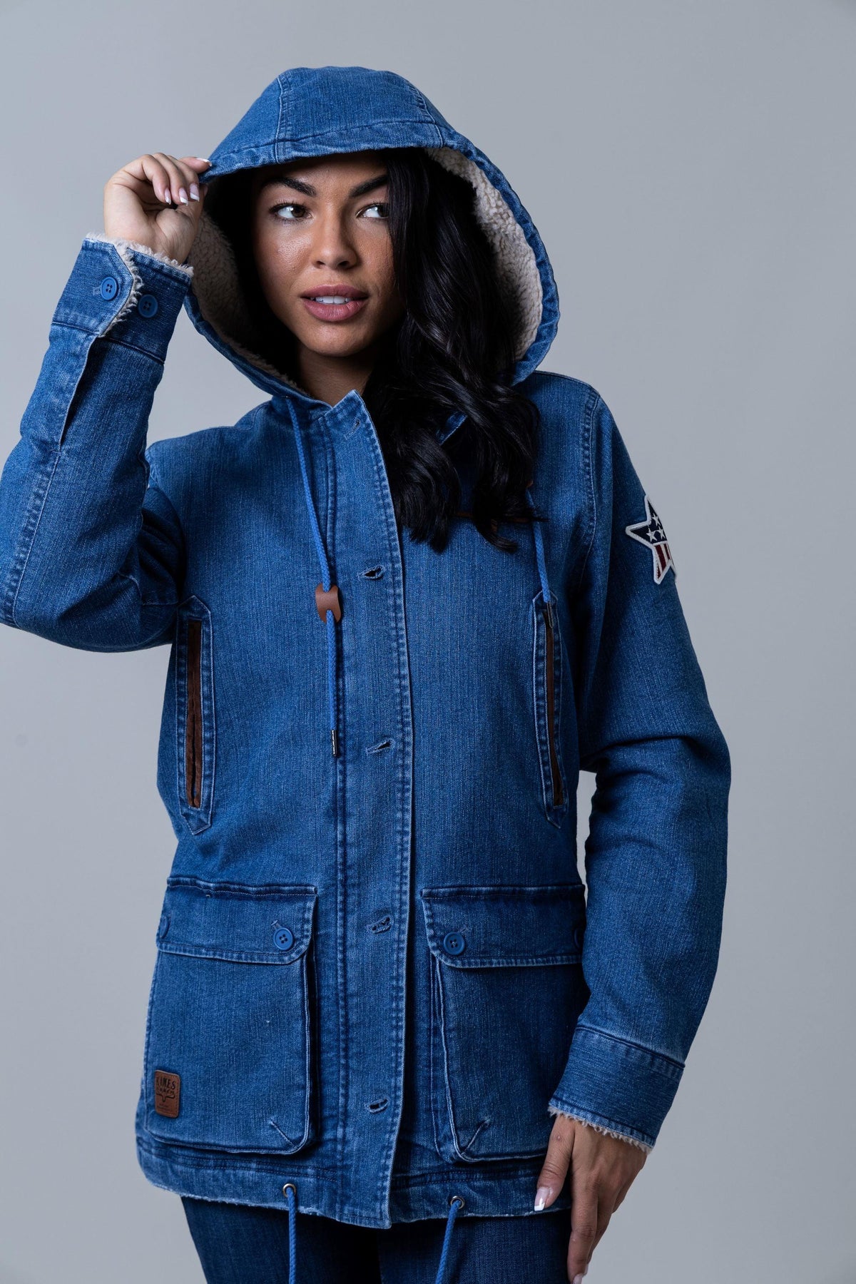 Kimes Ranch AWA Jacket in Light Wash Indigo with a hooded collar and front flap pockets