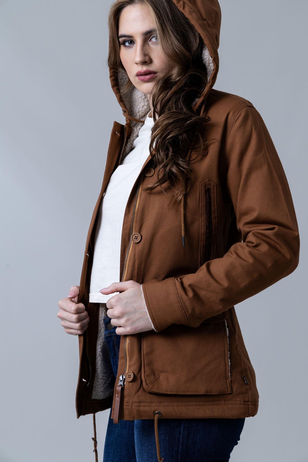 Kimes Ranch AWA Jacket in Work Wear Brown, side view, with sherpa-lined hood and front button placket