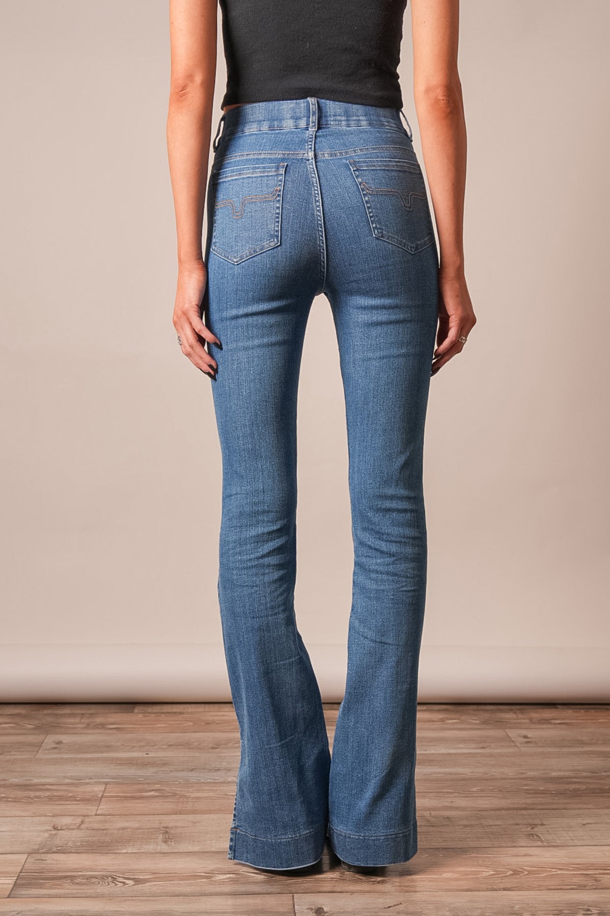 Kimes Ranch Aster jeans in Indigo, back view, with a flared leg and back pockets