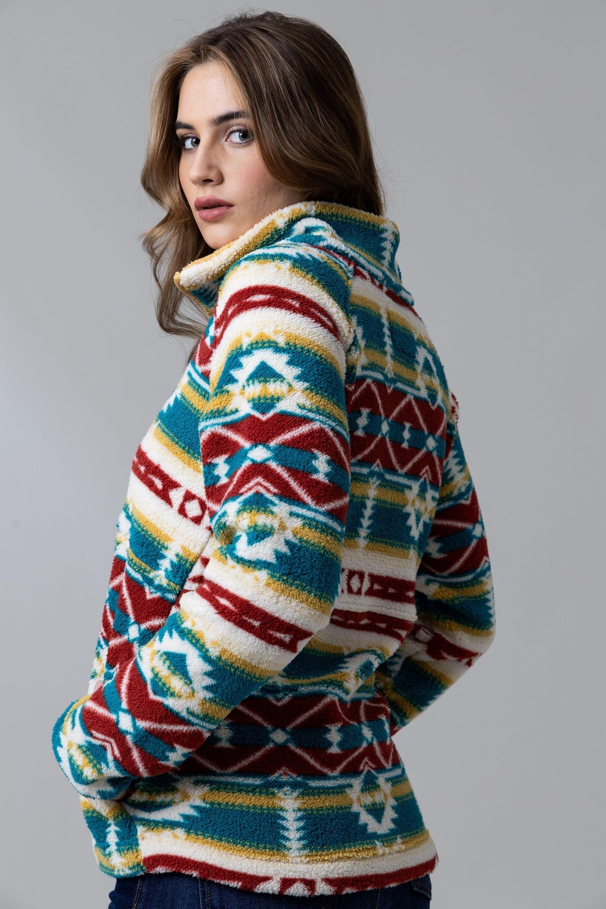 Kimes Ranch Roswell Polar Fleece sweatshirt in Matcha, side view, with a multi-color geometric pattern and a high collar