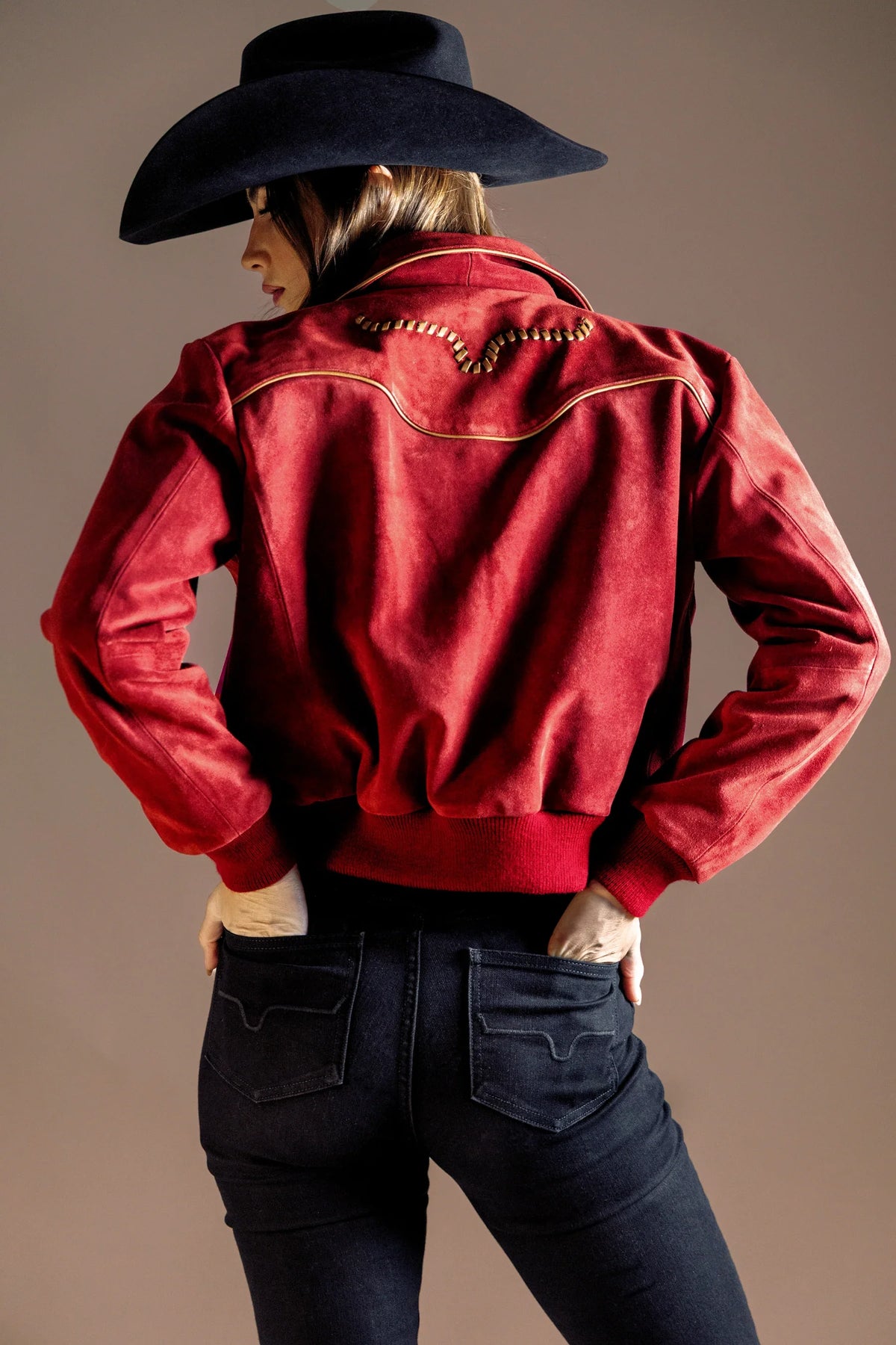 Kimes Ranch KR x Western & Co. Bomber Jacket, back view, in red with gold piping and logo on the back yoke