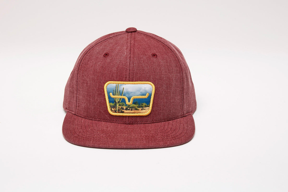 Kimes Ranch Buckley Hat in Port with a front patch showing a cactus and longhorn silhouette