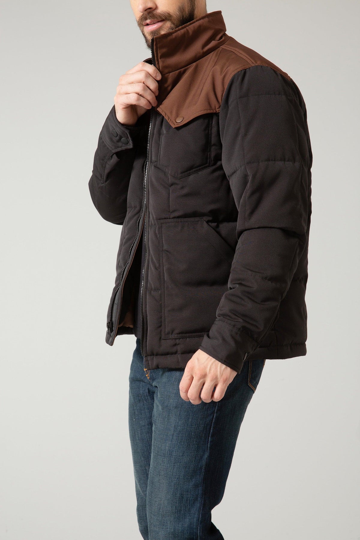 Kimes Ranch Colt Jacket in Black Brown, side view, with a brown stand-up collar and front pockets
