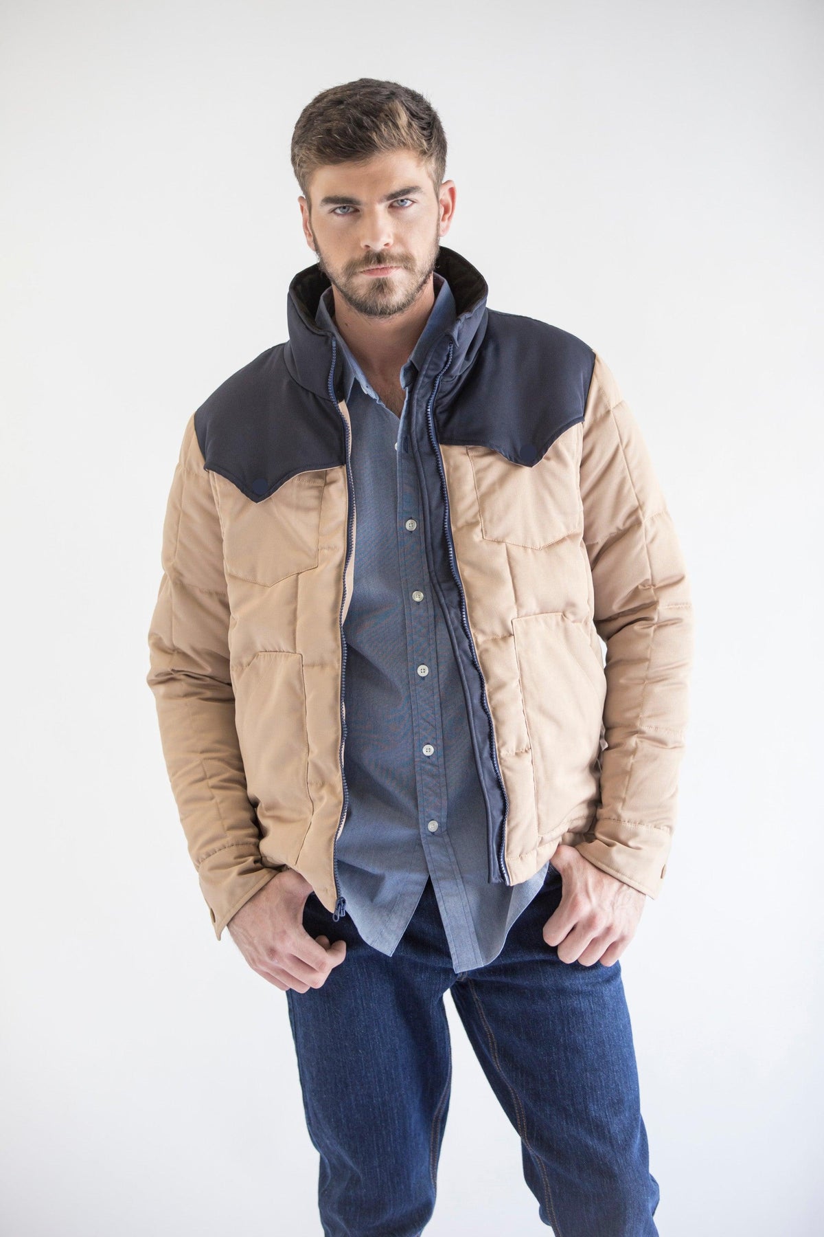 Kimes Ranch Colt Jacket in Navy Tan with a quilted navy yoke and front pockets