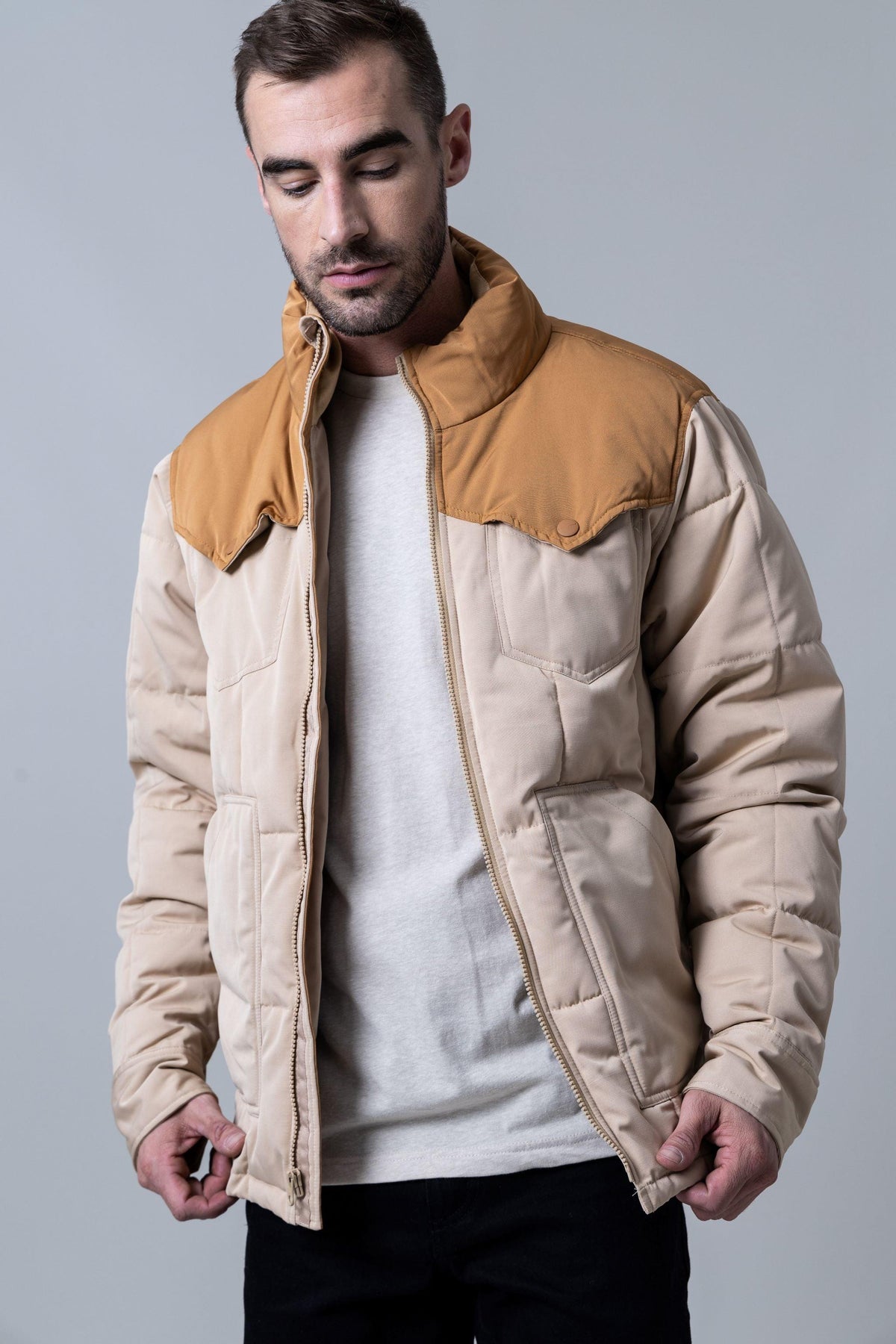 Kimes Ranch Colt Jacket in Tan with a quilted body, stand collar, and front zip closure