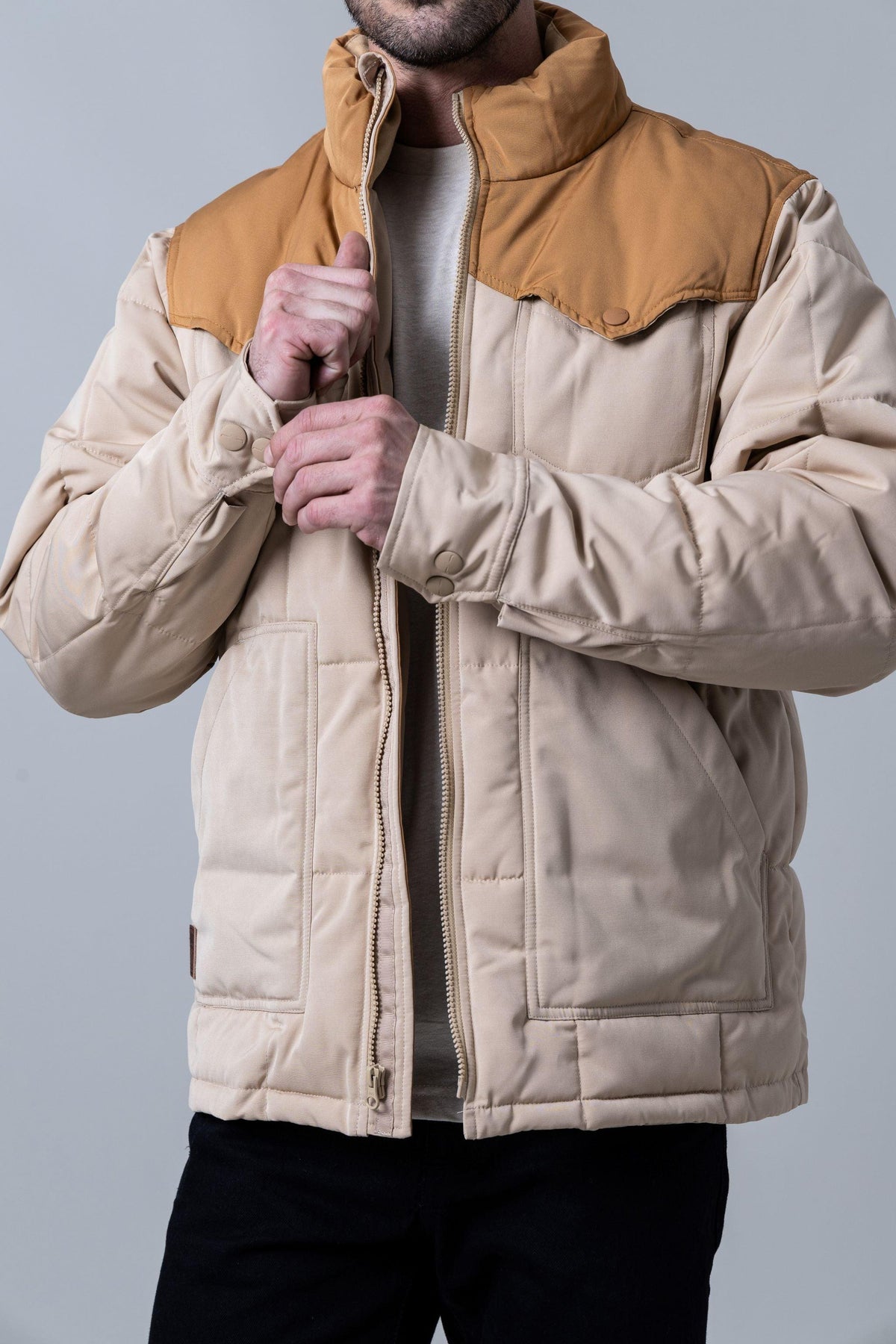 Kimes Ranch Colt Jacket in Tan with a quilted body, snap-button collar, and front zip closure