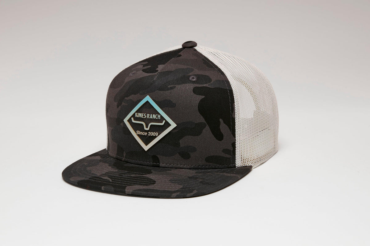 Kimes Ranch Diamond Dogs Trucker Hat in Night Camo, side view, with a mesh back and logo patch